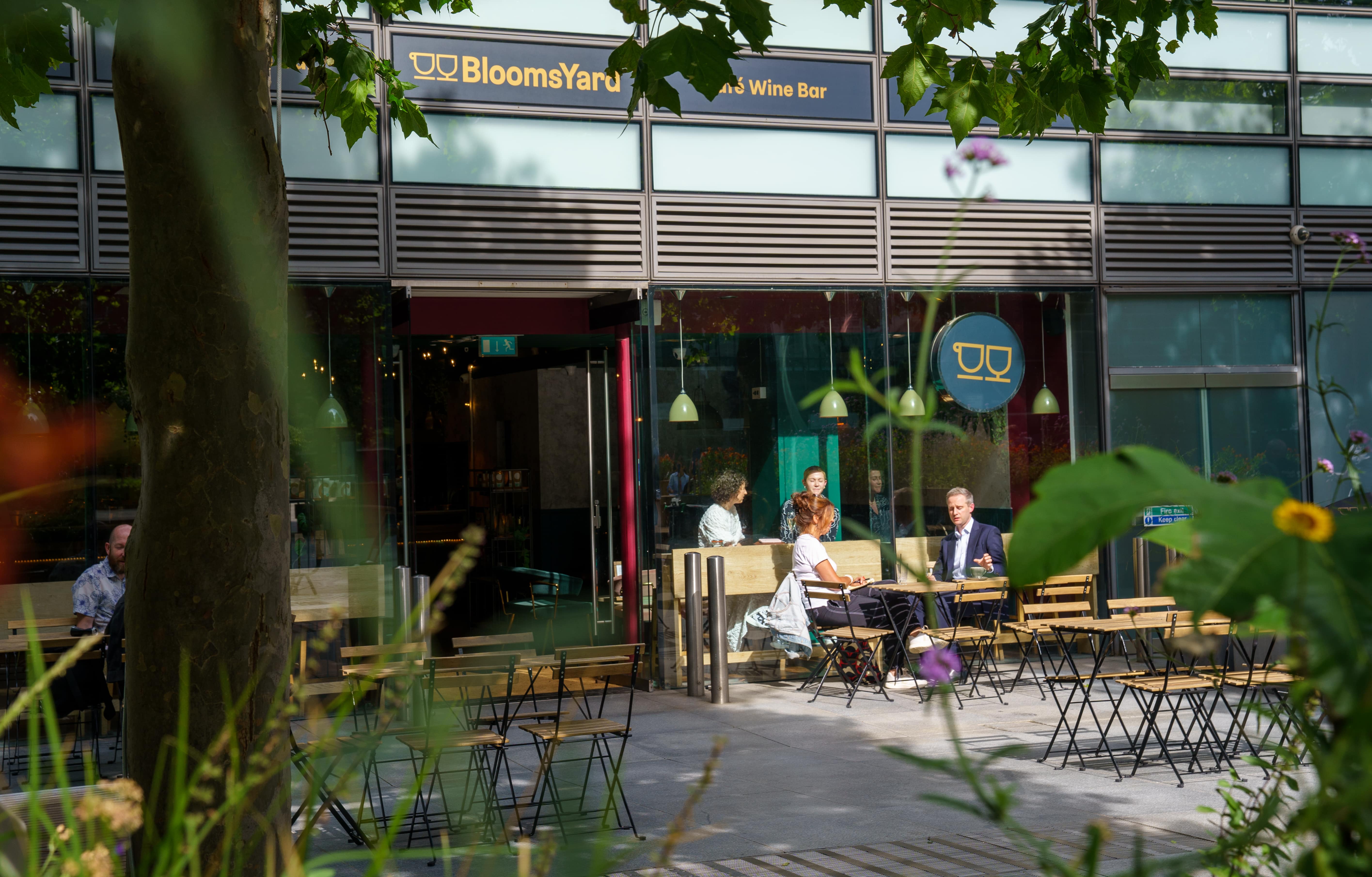 Vibrant outdoor seating at BloomsYard wine bar, perfect for networking events.