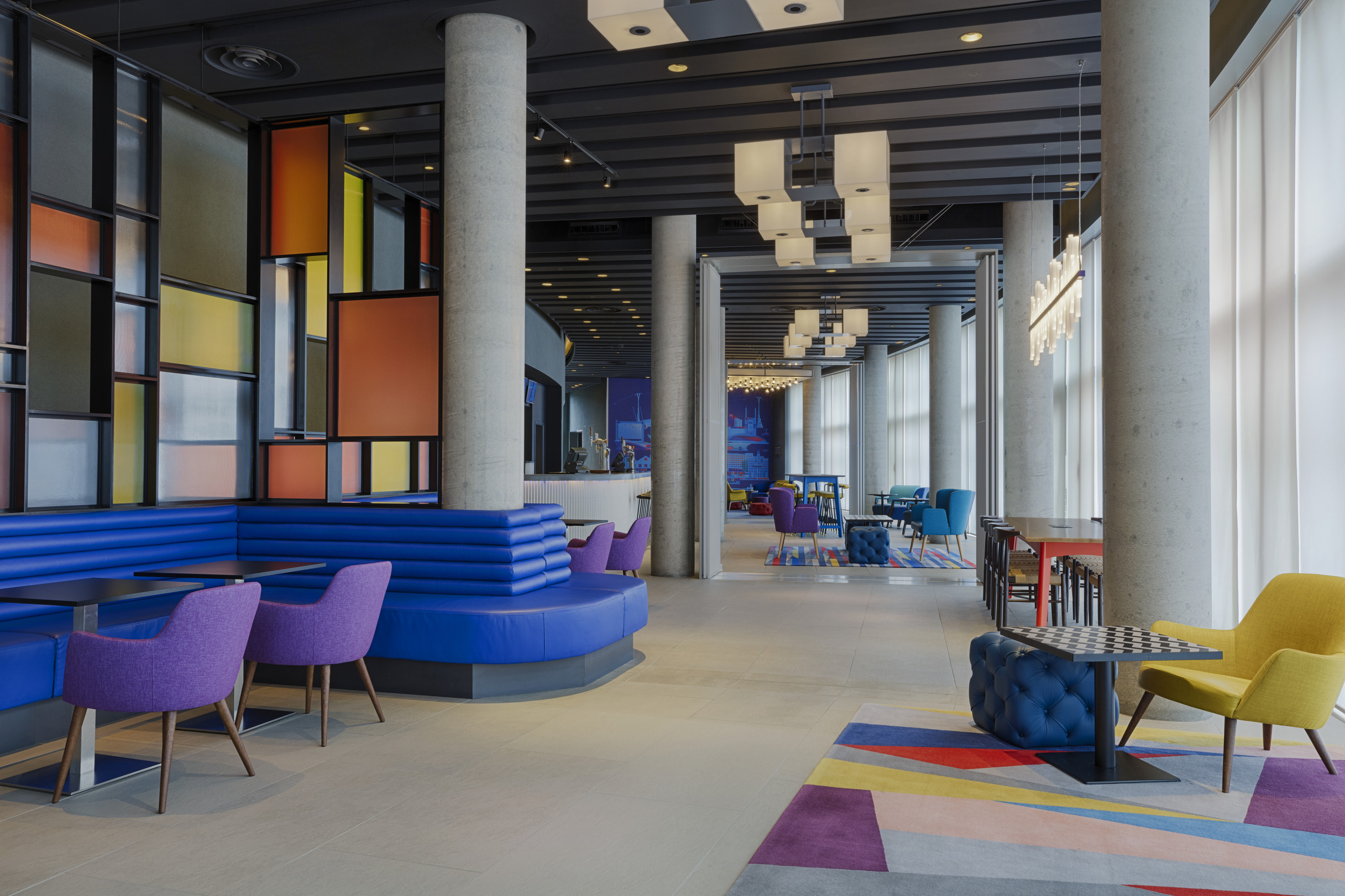 Vibrant WXYZ bar at Aloft London ExCeL, ideal for networking events and meetings.