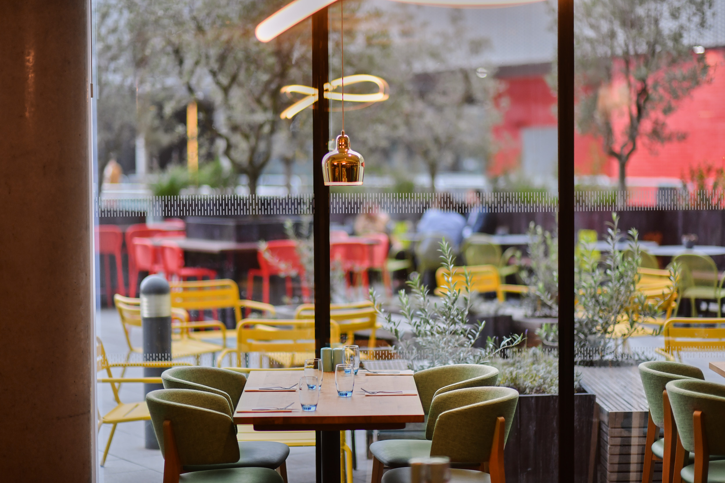 Docksider Restaurant at Aloft London ExCeL, vibrant dining space for casual meetings and events.