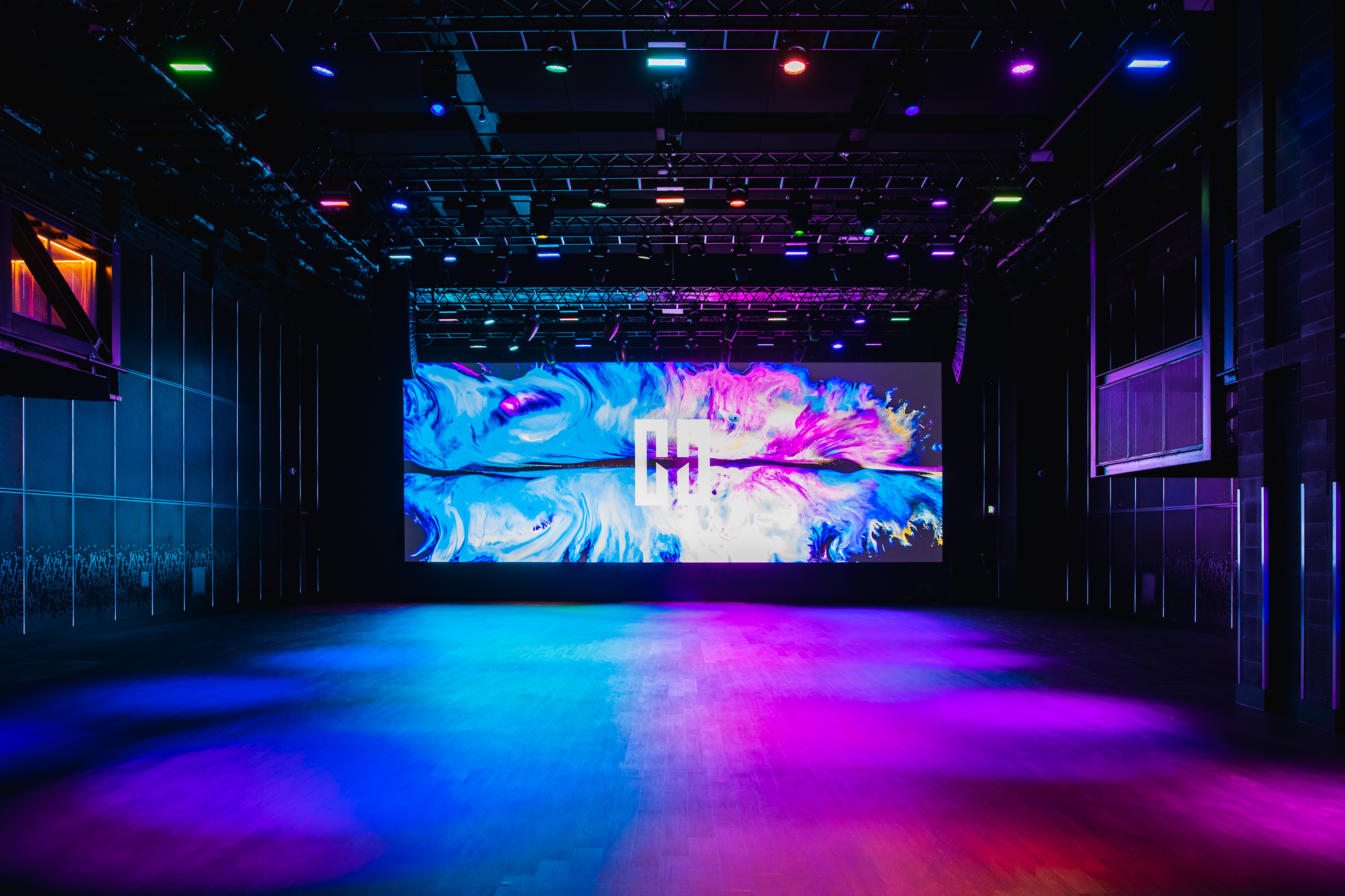 Versatile event space at Outernet London with vibrant LED screen for corporate and entertainment events.