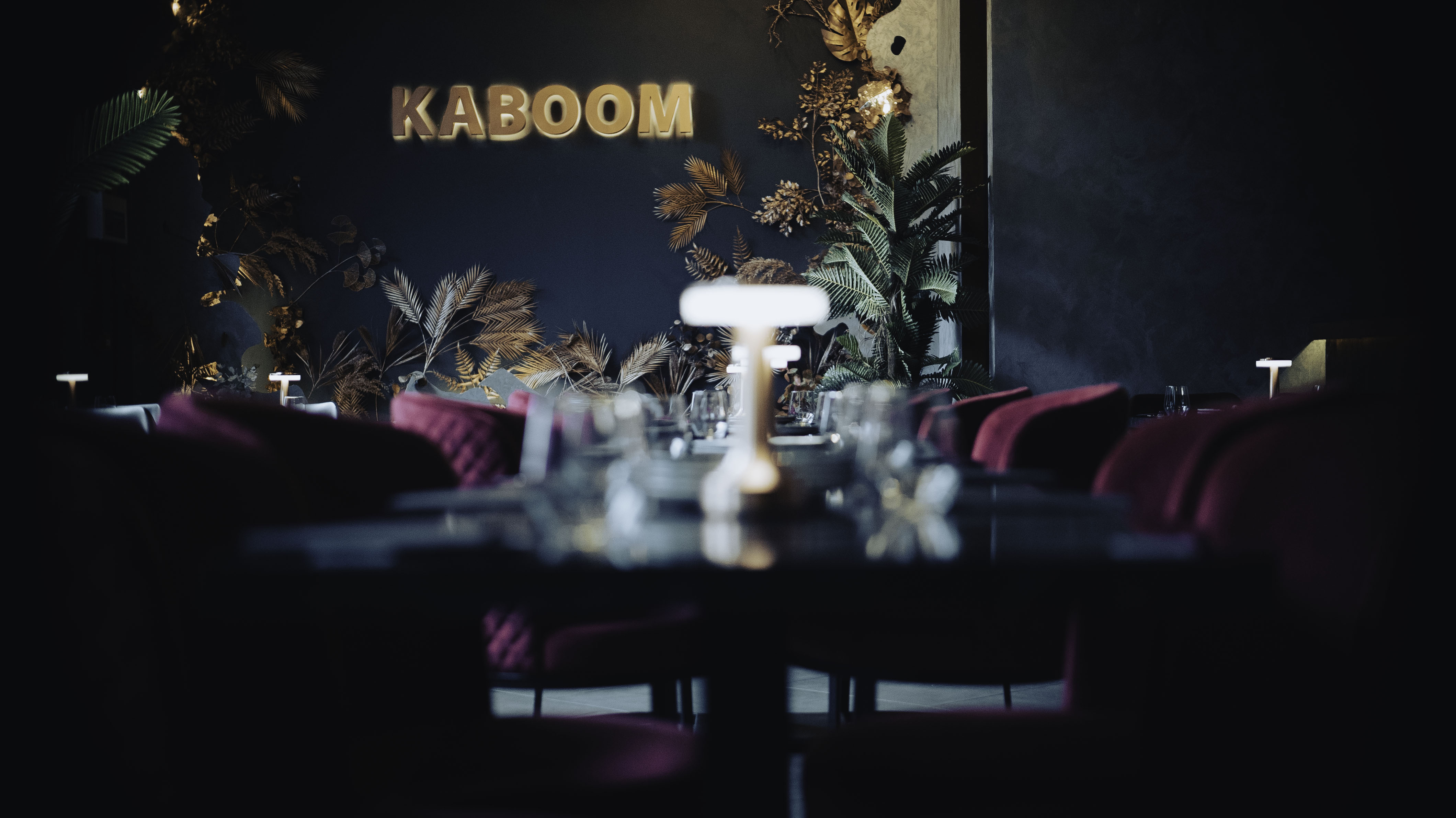 Stylish Kaboom Lounge event space with plush seating and vibrant decor for upscale gatherings.