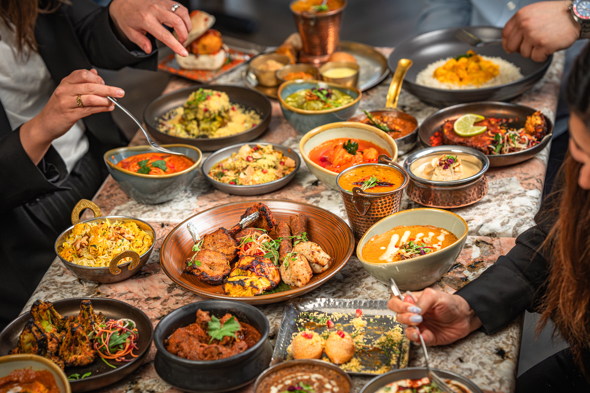 Private dining setup at Bombay Delight with vibrant dishes for culinary events.