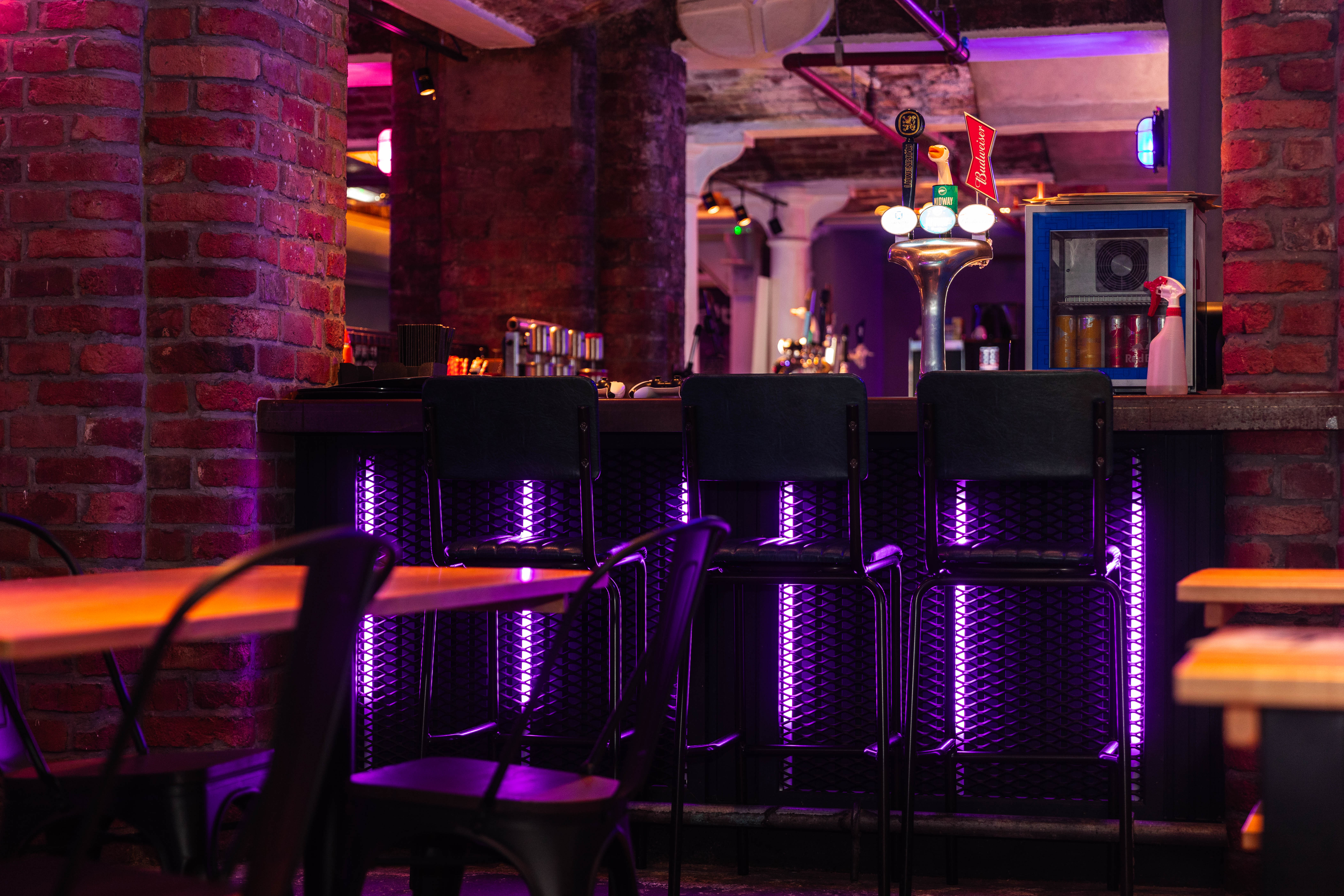 Stylish bar with modern lighting in vibrant venue for networking events and social gatherings.