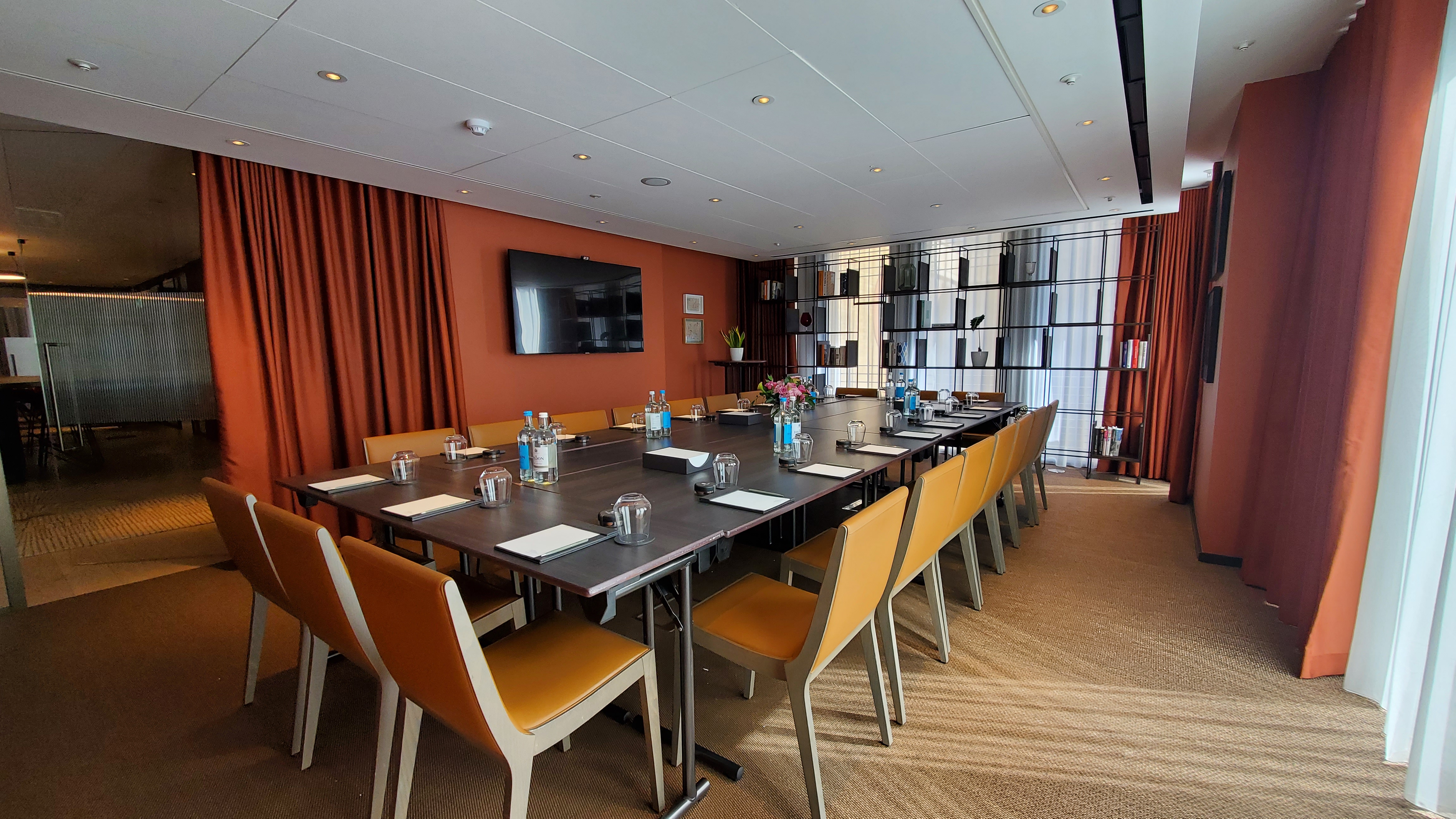 Modern meeting room in Pan Pacific London, ideal for professional gatherings and presentations.