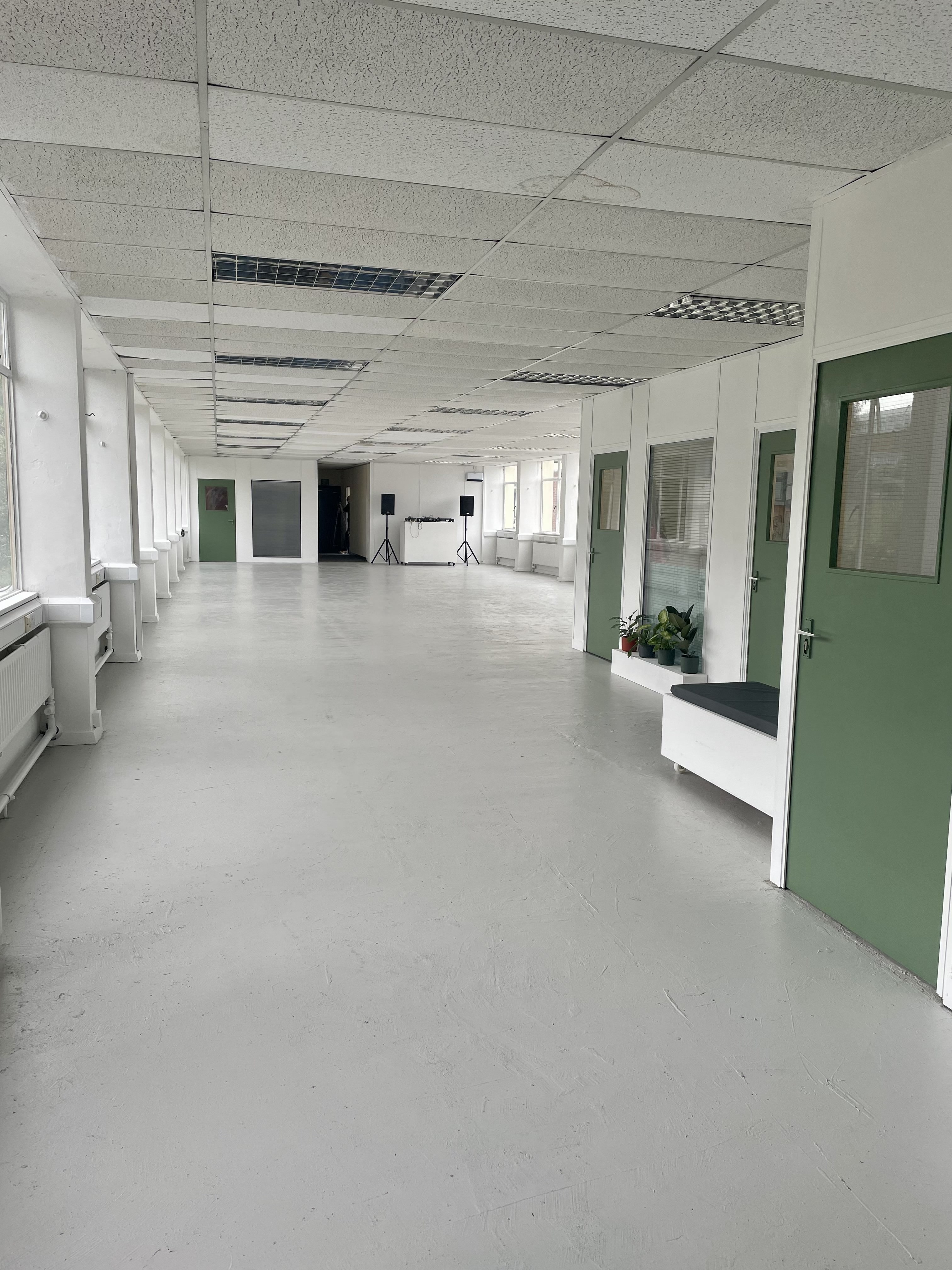 Spacious PINK gallery venue with natural light for meetings and events.