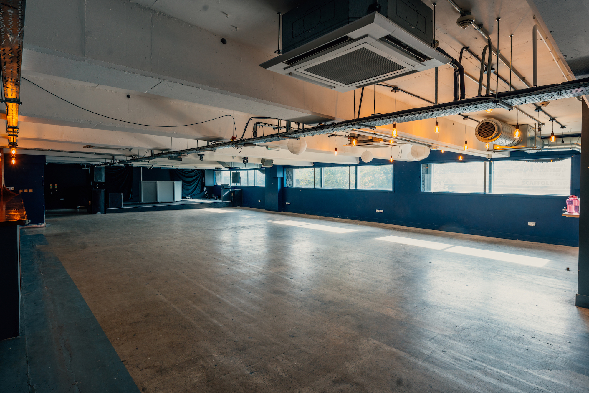 Versatile event space in Peckham Levels with natural light, ideal for meetings and workshops.