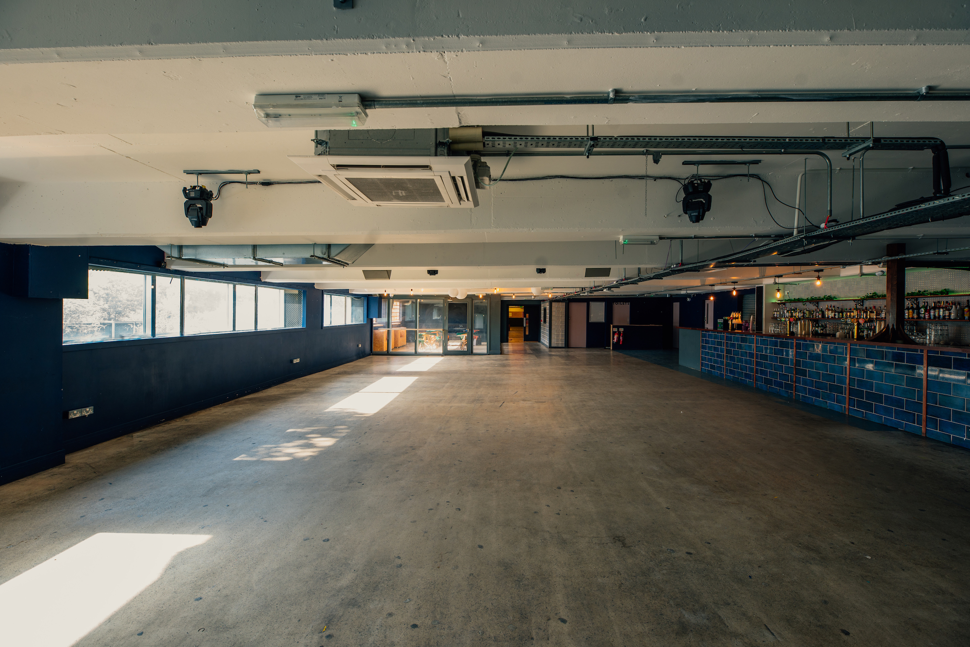 Spacious event venue in Peckham Levels with natural light for meetings and workshops.