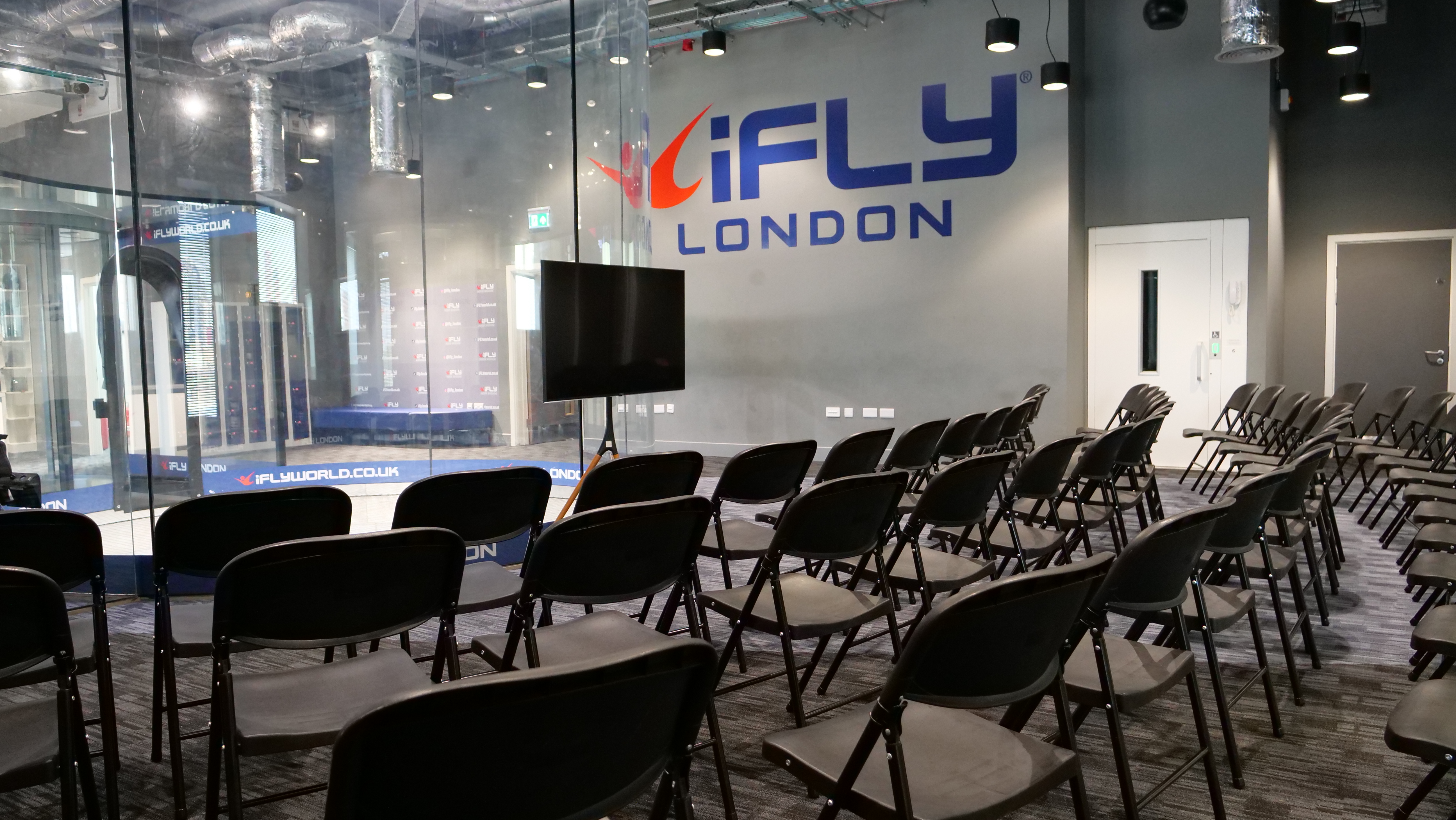 iFLY Indoor Skydiving event space with chairs, ideal for corporate gatherings and team-building.
