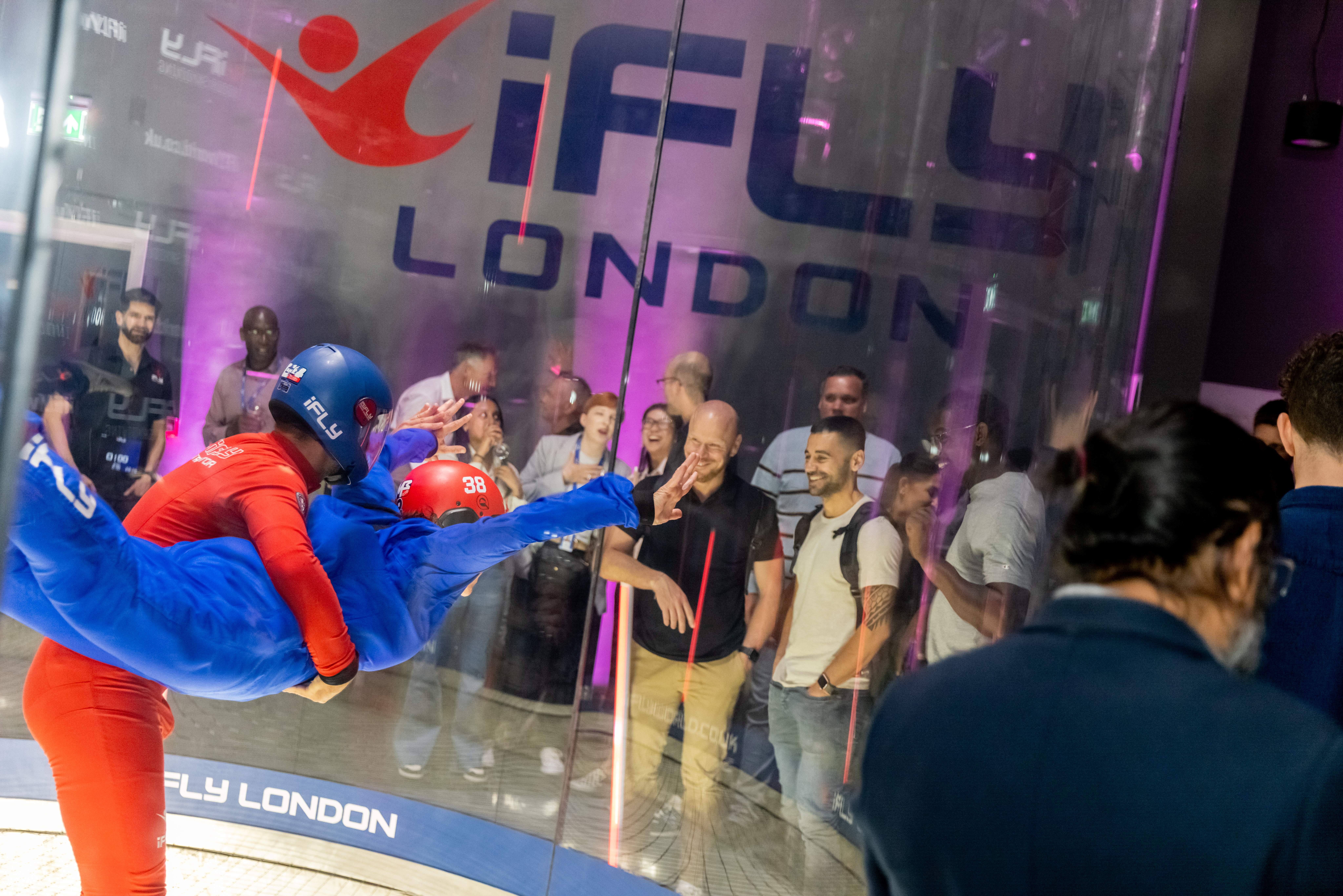 Indoor skydiving at iFLY London, vibrant Flight Deck for team-building events.
