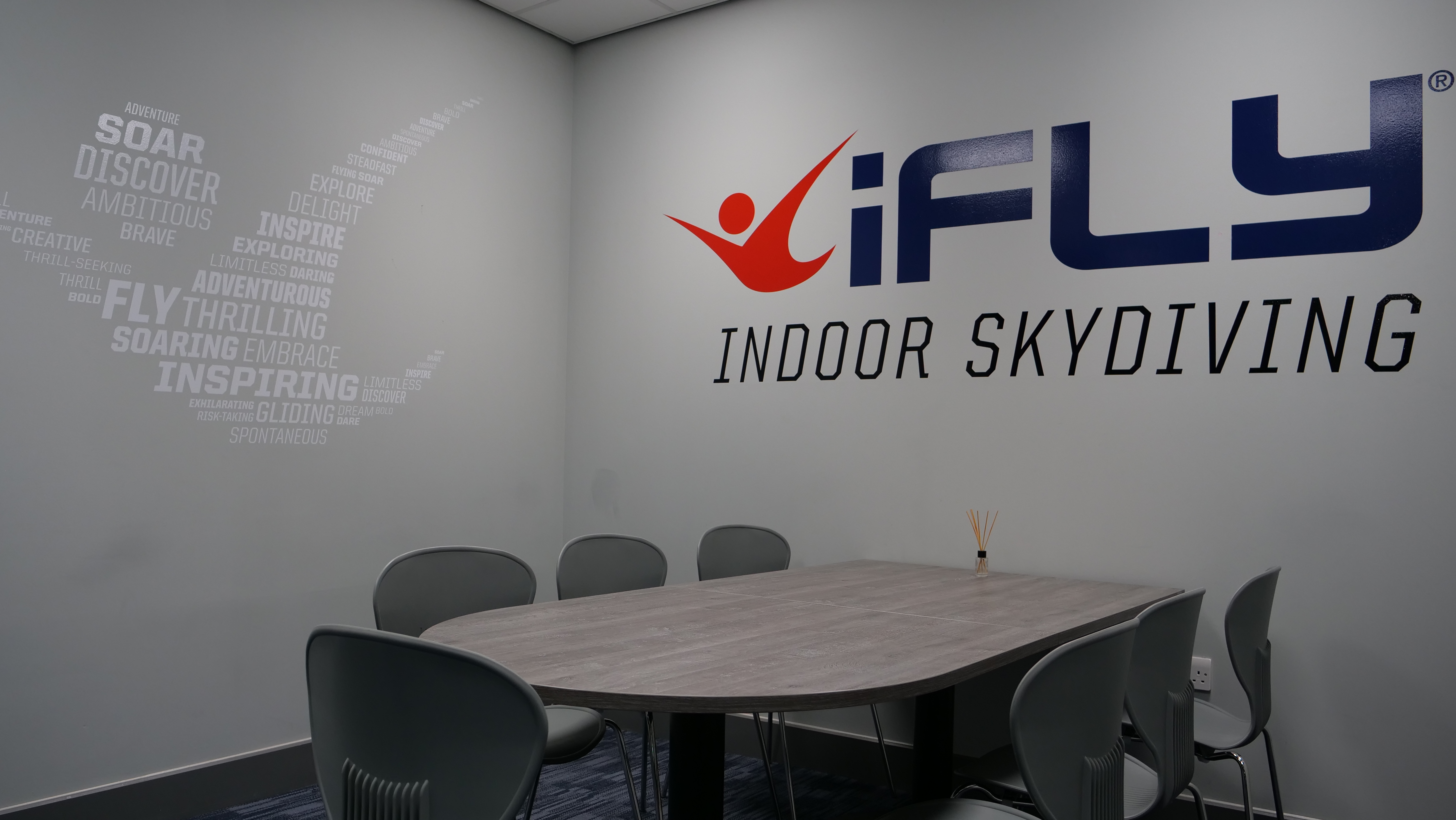 Modern meeting room at iFLY Indoor Skydiving, perfect for team-building events.