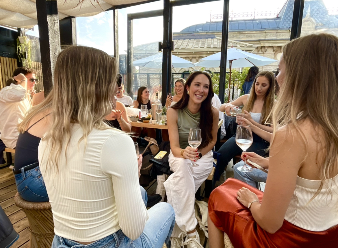 Vibrant networking event in stylish Roof Garden with natural light and chic decor.