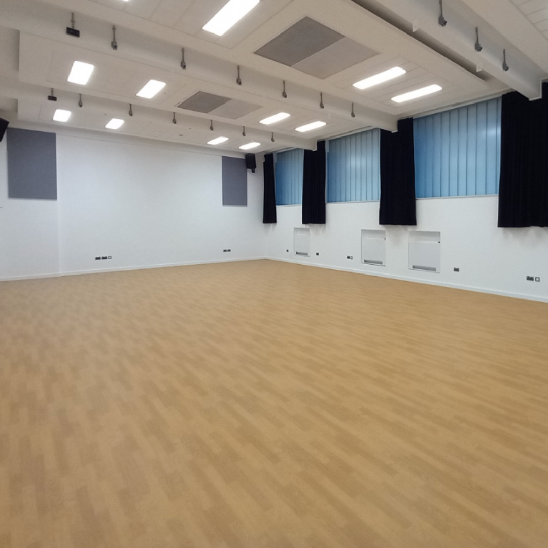 Versatile event space in YMa Pontypridd with natural light, ideal for workshops and seminars.
