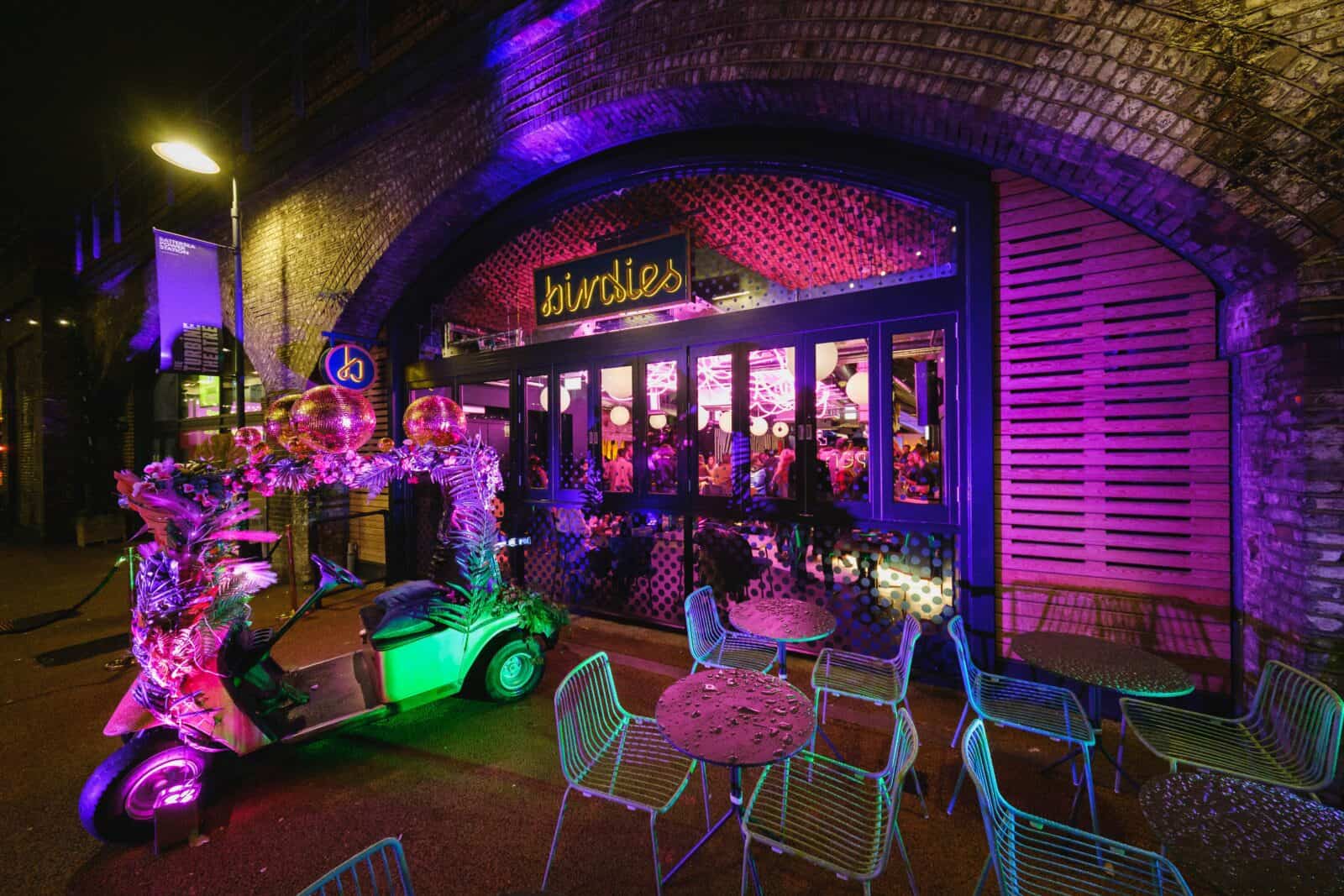 Vibrant Birdies Crazy Golf entrance with colorful lighting for lively events and gatherings.