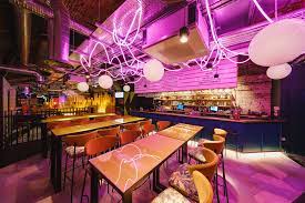 Vibrant Birdies Crazy Golf venue with purple lighting for creative events and receptions.
