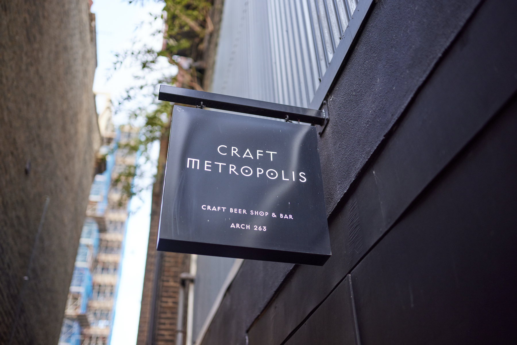 Craft Metropolis Brixton sign, modern craft beer shop for networking events.
