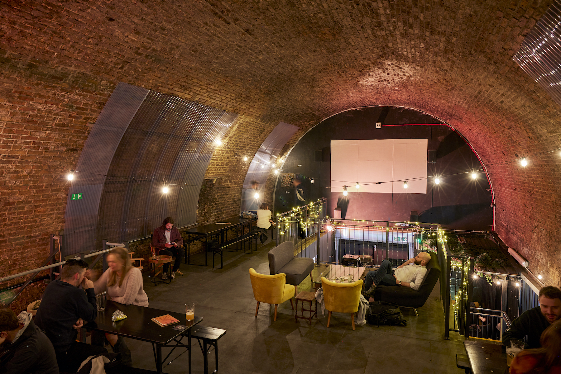 Rustic brick archway in Craft Metropolis Brixton, perfect for creative events and gatherings.