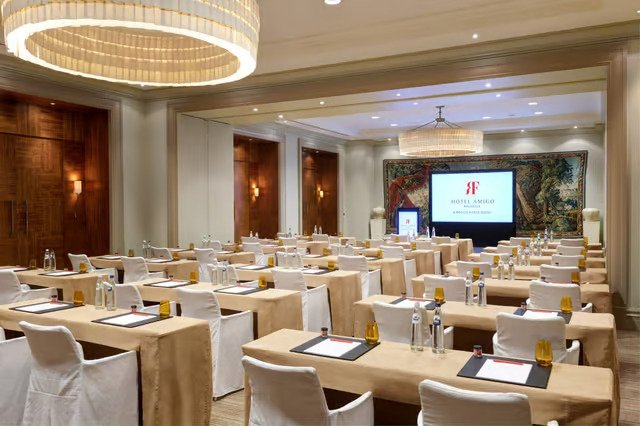 Ambassadors in conference room at Brussels Marriott for professional event, organized setup.