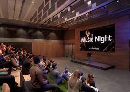 Auditorium in Unity Place set for Music Night with engaged audience and optimal lighting.