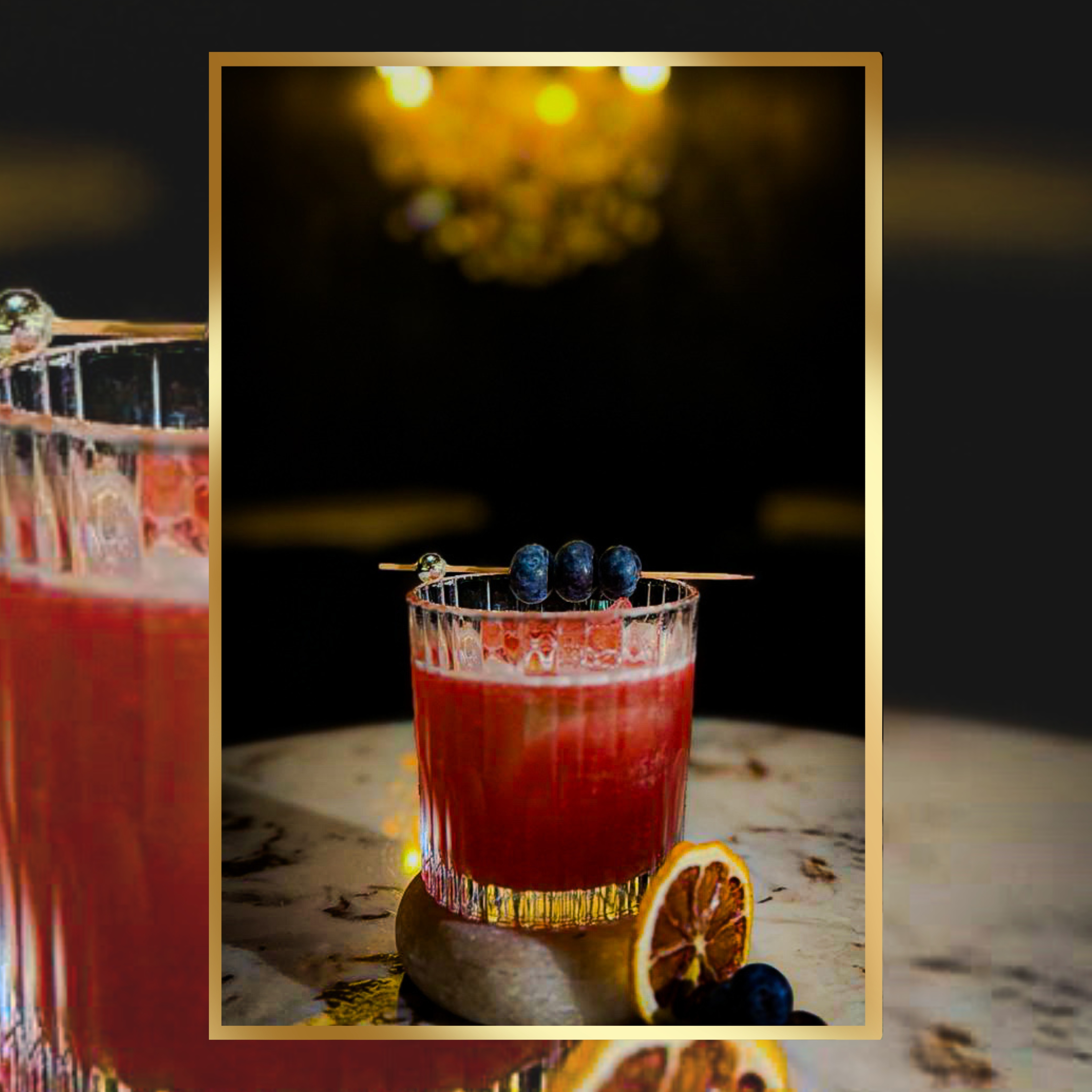 Elegant cocktail with blueberries, perfect for upscale events and gatherings.