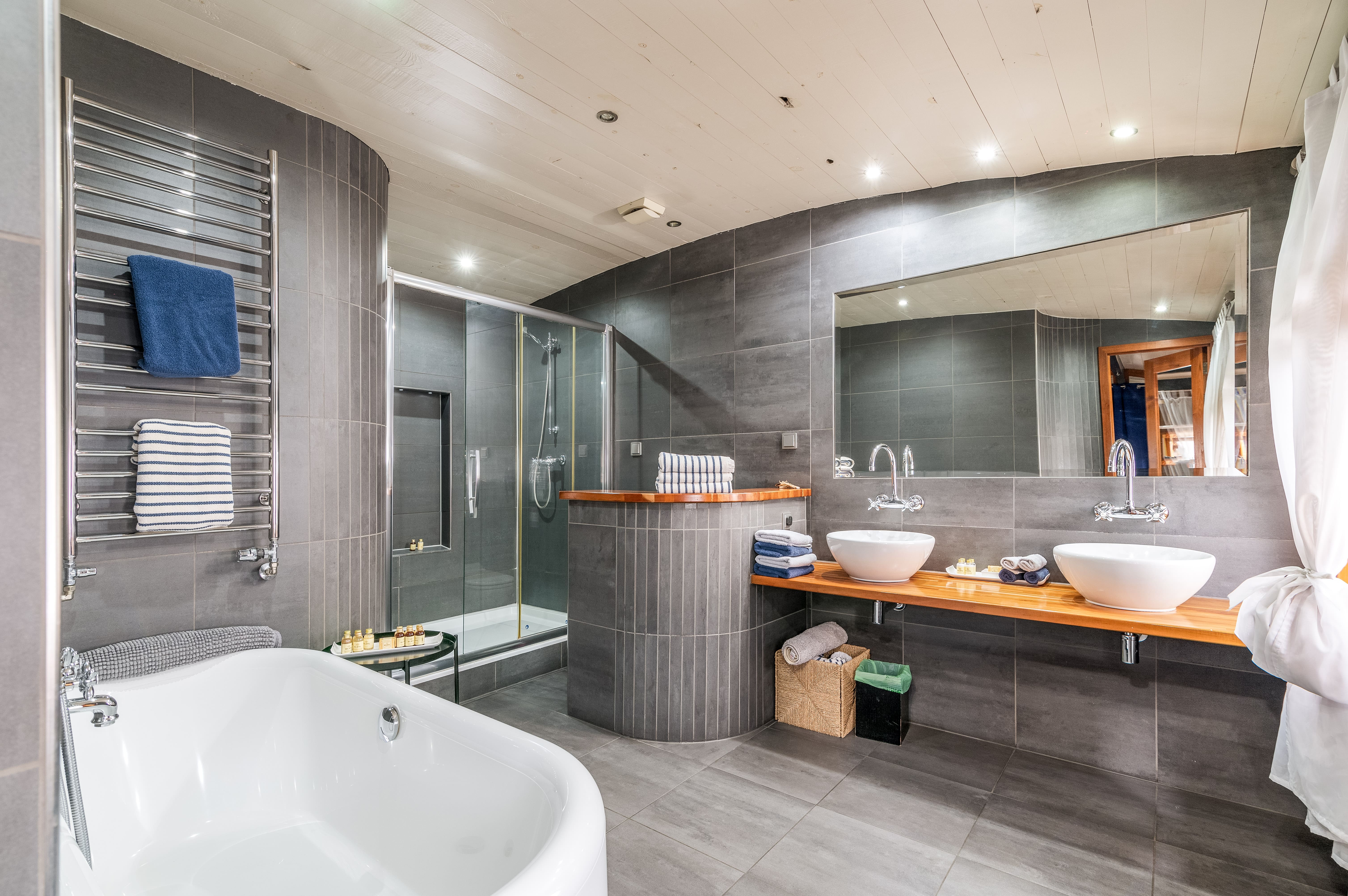 Modern bathroom with dual sinks, ideal for luxury event venues and guest comfort.
