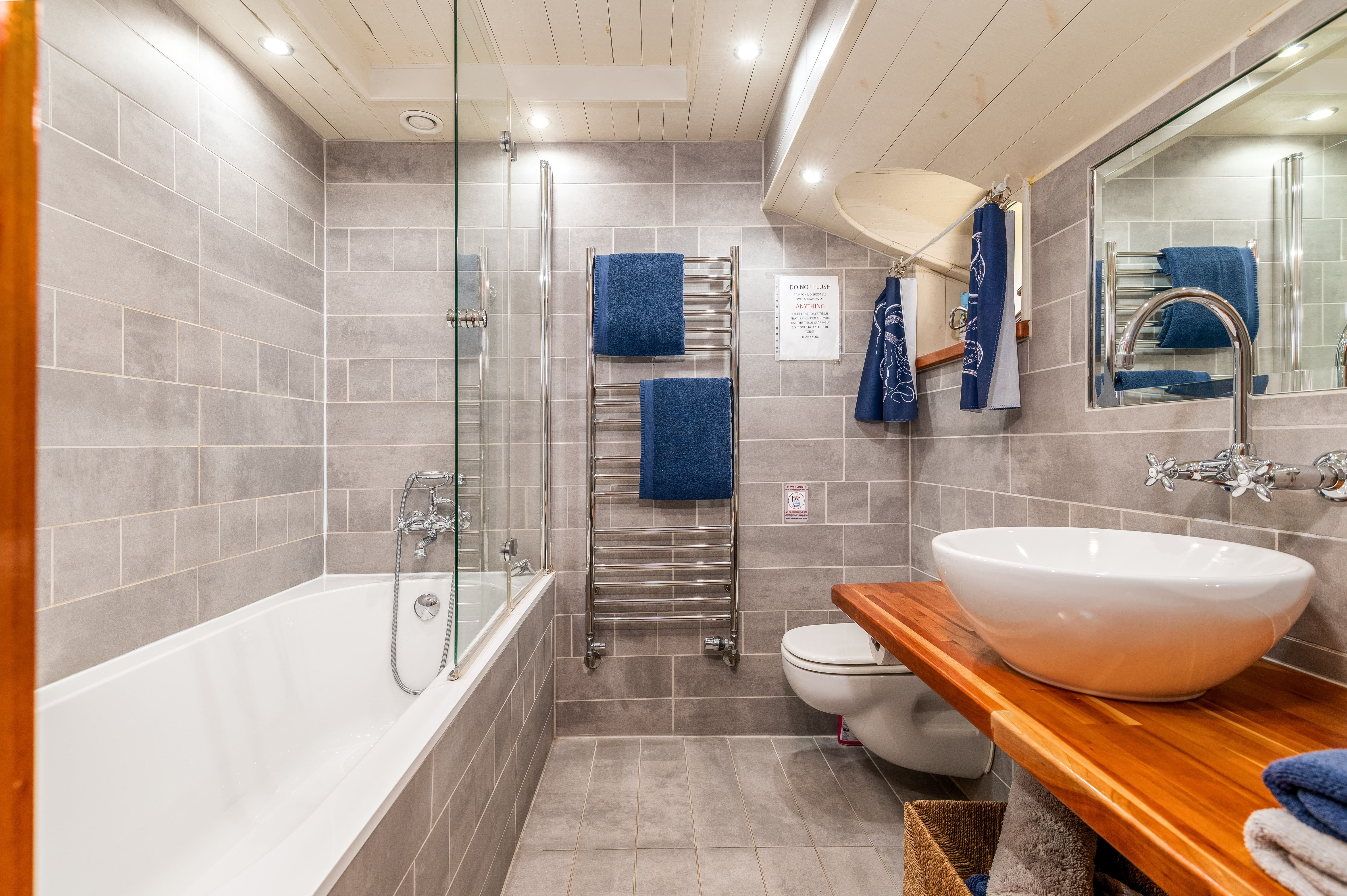 Modern bathroom with sleek tilework for upscale events and meetings.