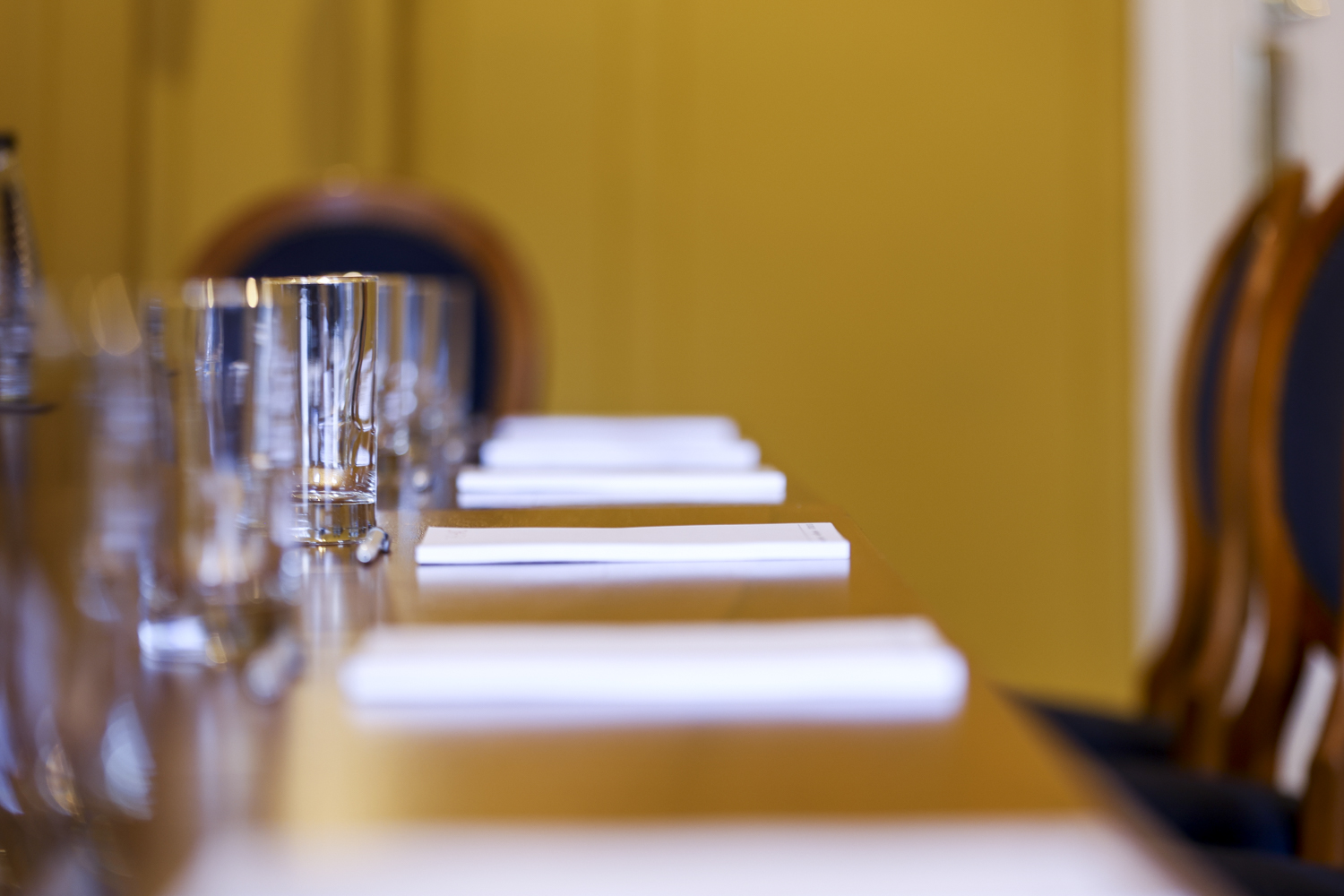 Queen's Room at The HAC; elegant meeting table set for professional gathering.