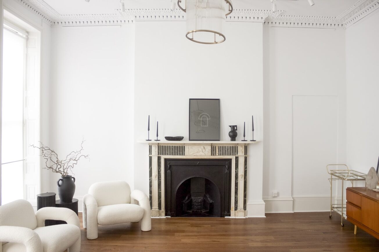 Evelyn Room event space with elegant fireplace, ideal for gatherings and networking.