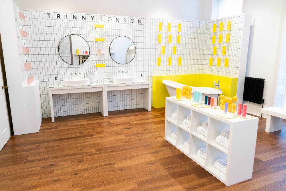 Modern beauty event space with dual sinks, ideal for workshops and product demos.