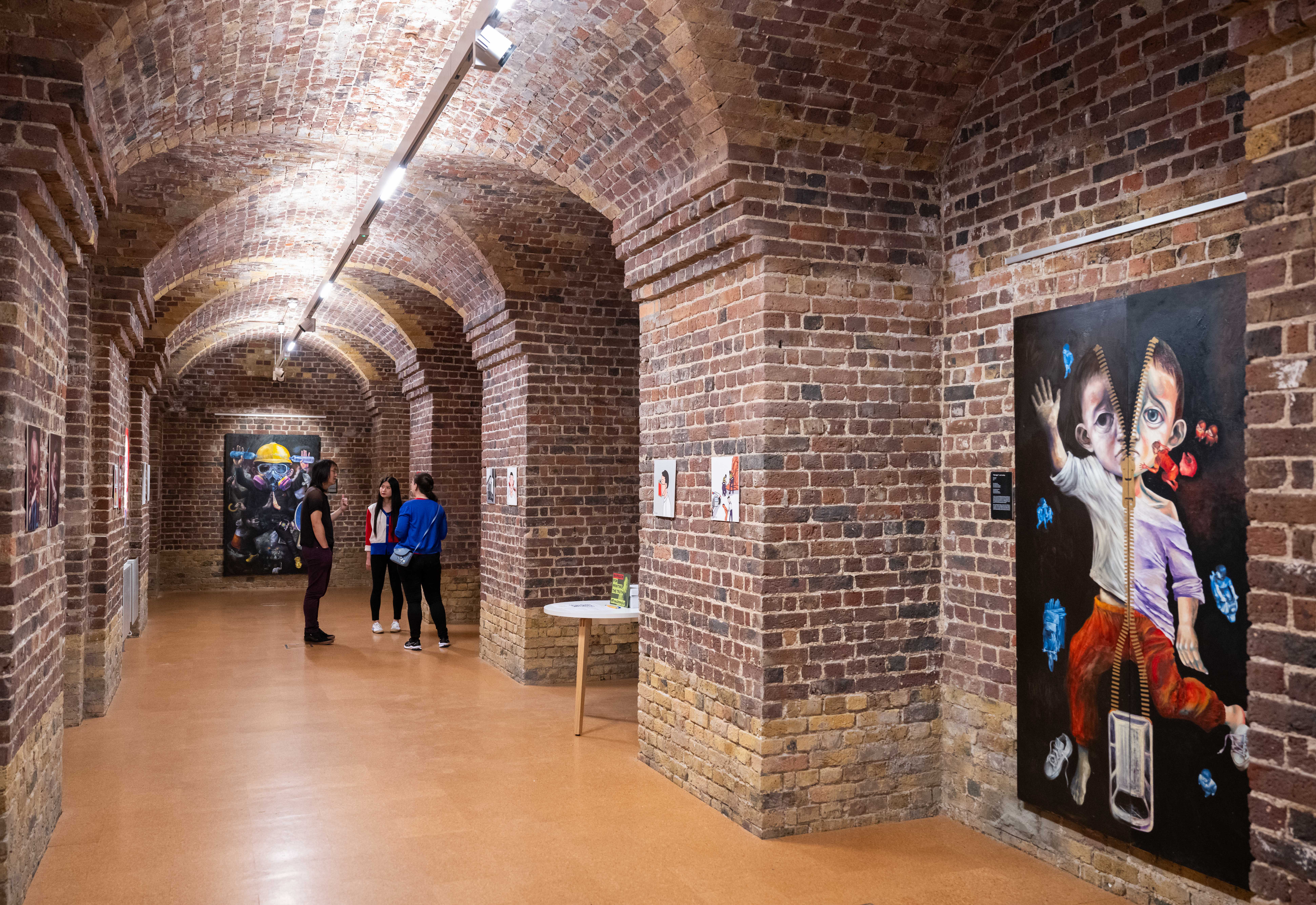 "Stylish Old Crypt venue in St John's Church, perfect for art exhibitions and networking."