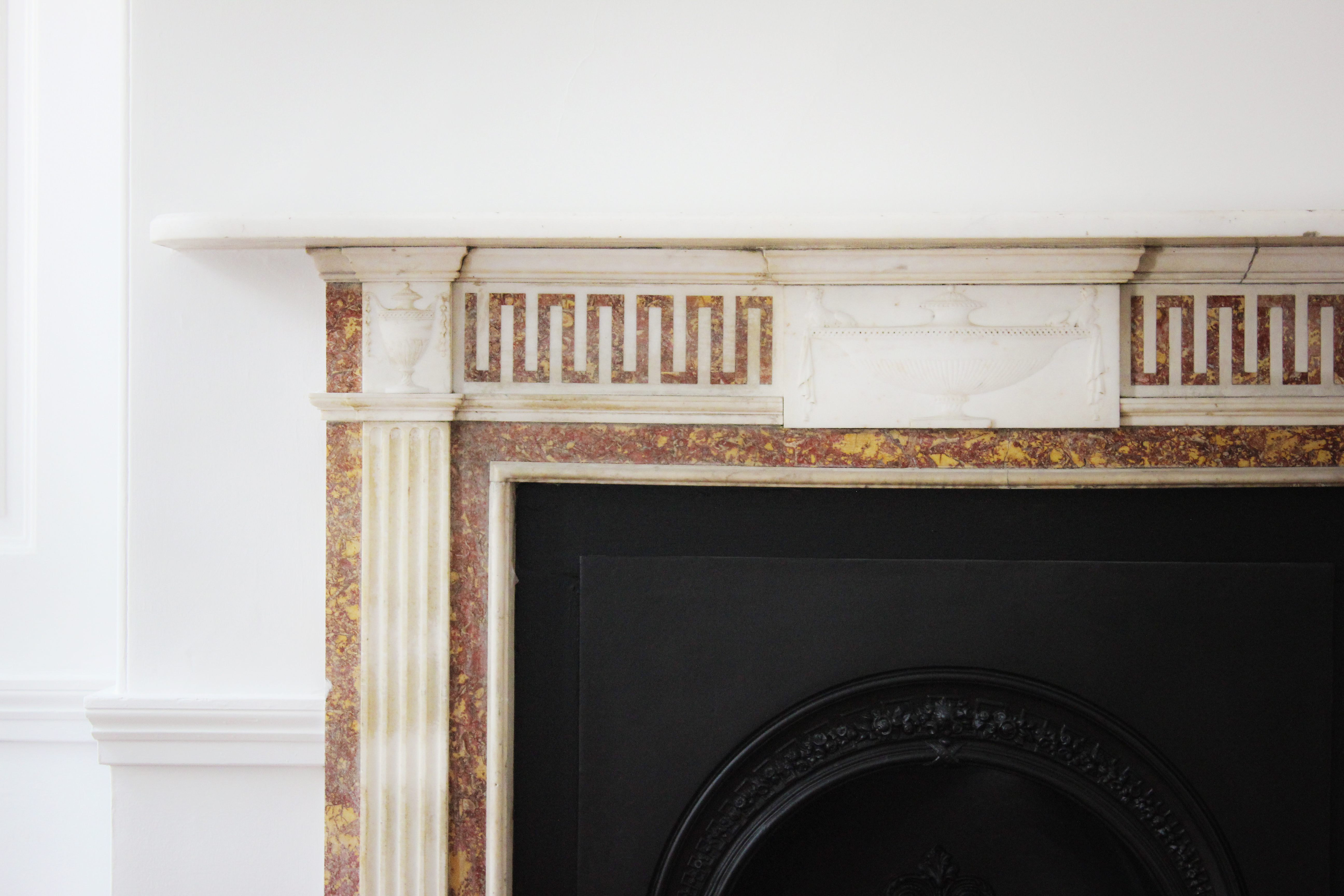Elegant fireplace mantel in The Morrell Room, perfect for events and gatherings.