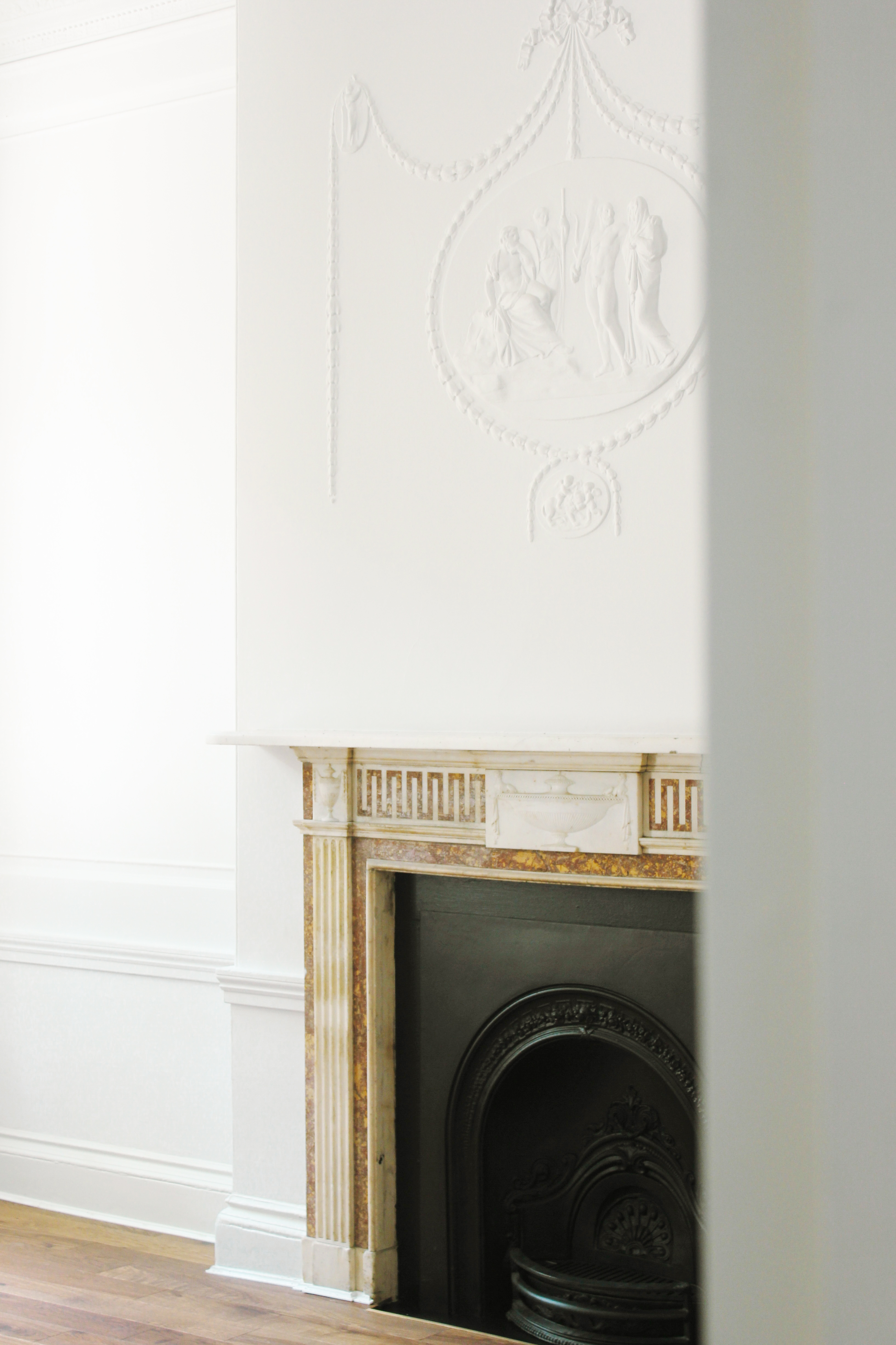 Elegant Morrell Room with detailed fireplace, perfect for upscale meetings and gatherings.