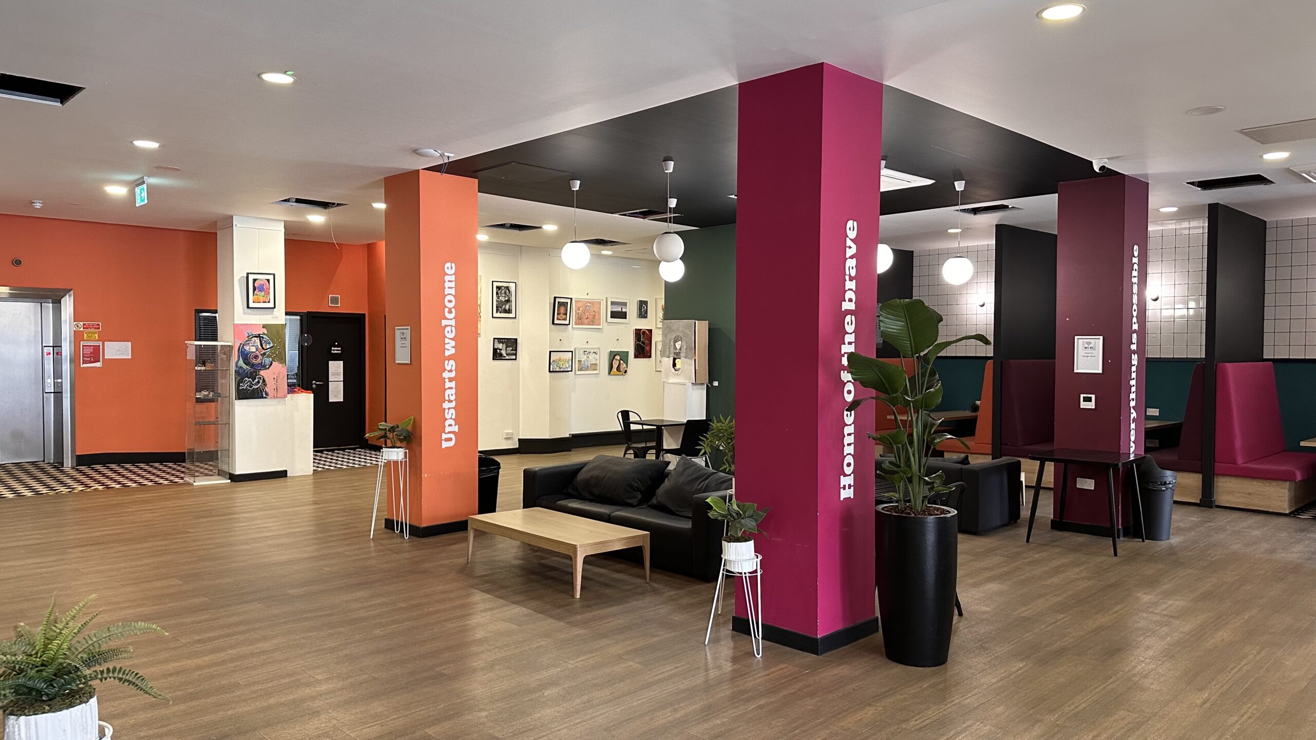 Modern Glasgow meeting room with vibrant decor, perfect for networking events and casual meetings.