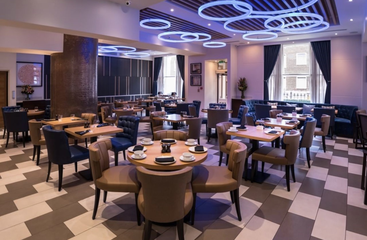 Modern dining space at Norfolk Towers, ideal for networking events and private dinners.