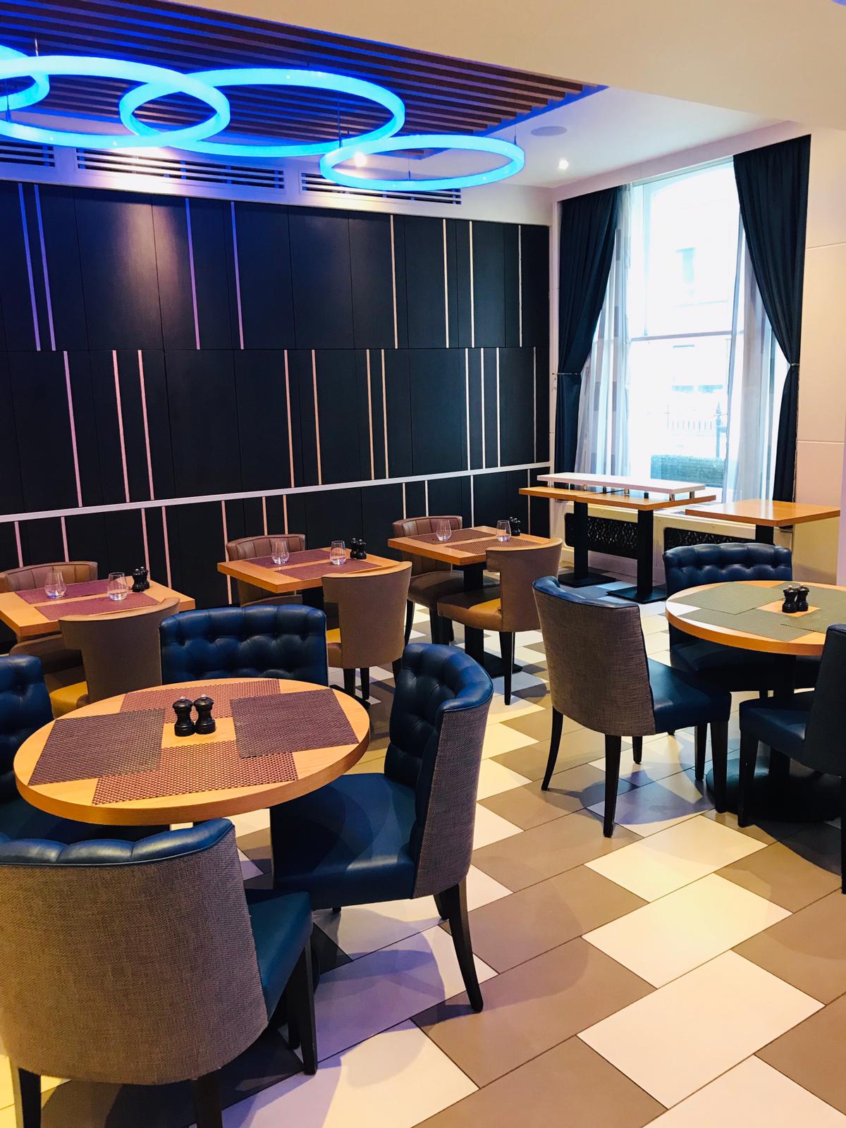 Modern dining space at Norfolk Towers, perfect for intimate events and networking.