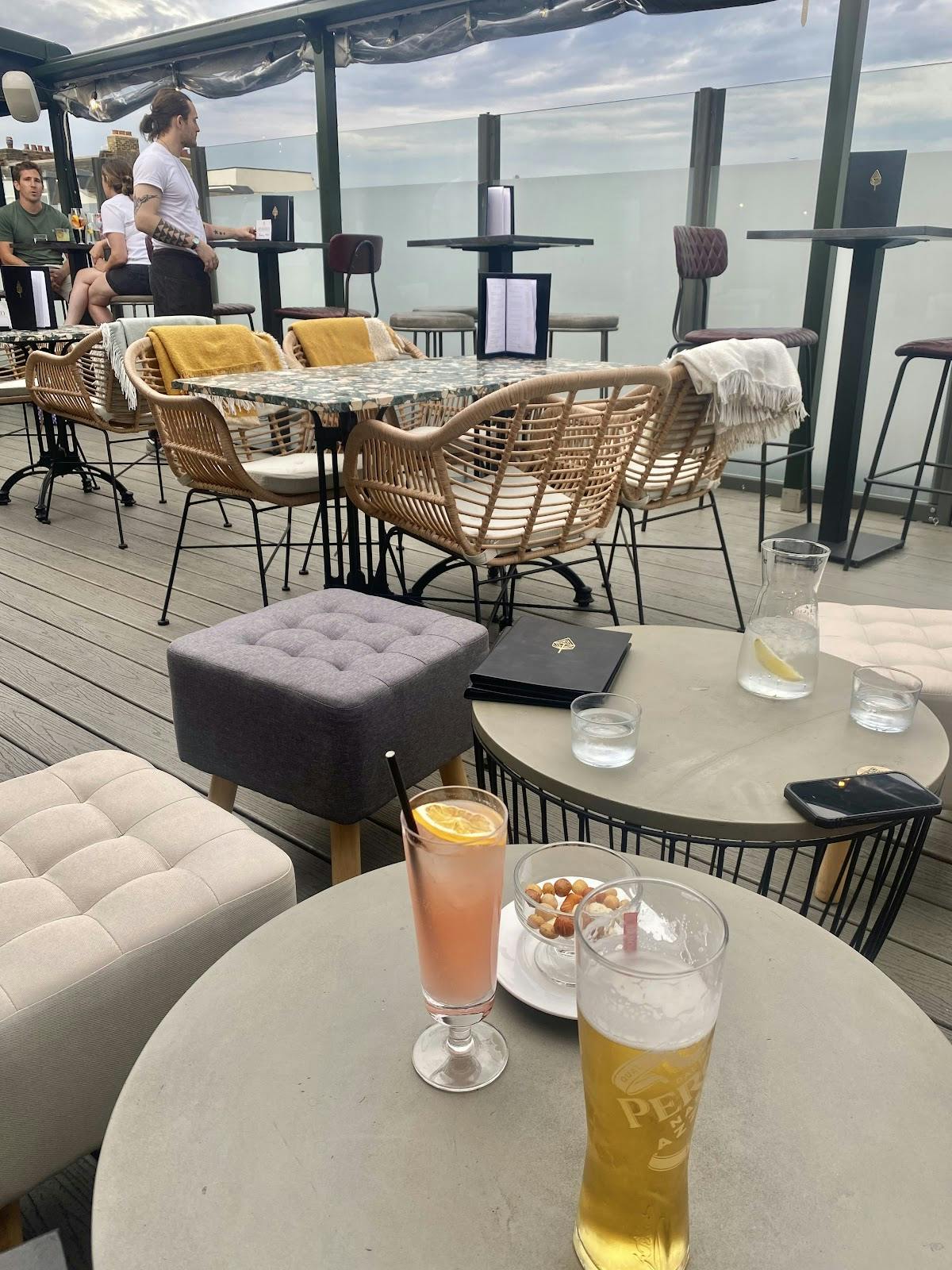 Stylish Rooftop Lounge at The Corin, perfect for casual meetings and social events.