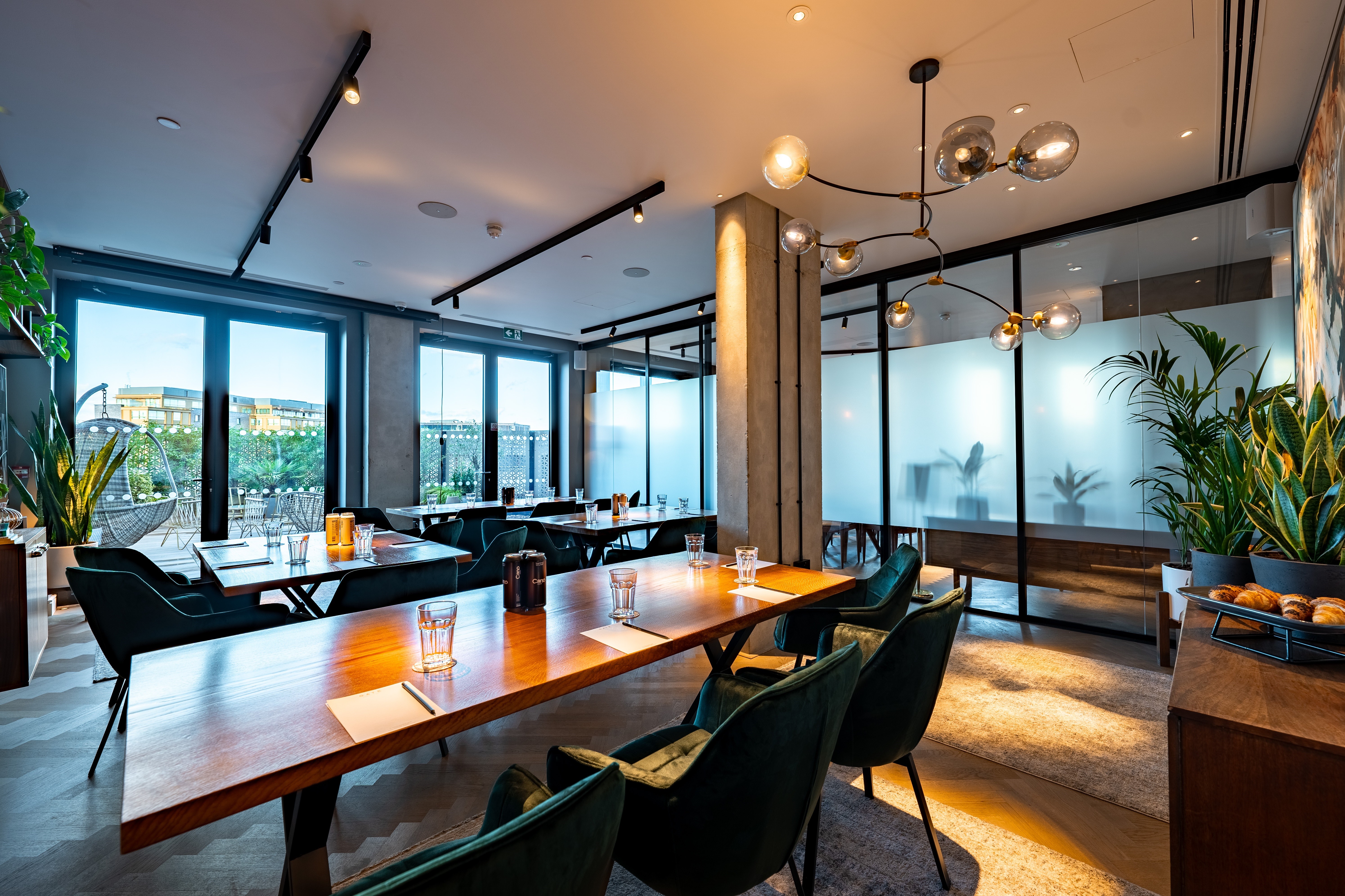 Modern meeting space with large windows at The Gate Aparthotel for corporate events.