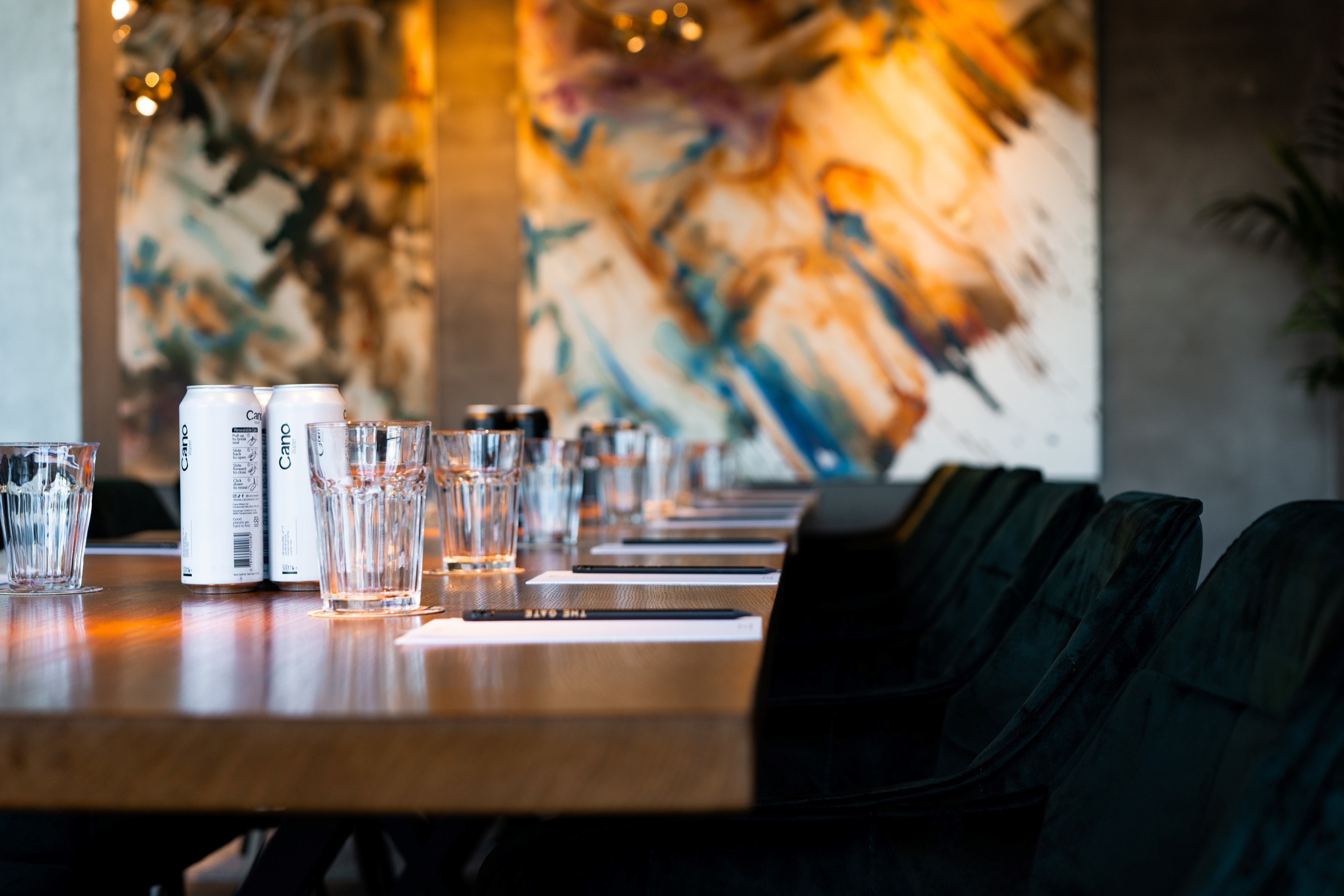 Modern meeting space with long wooden table, ideal for corporate events at The Gate Aparthotel.