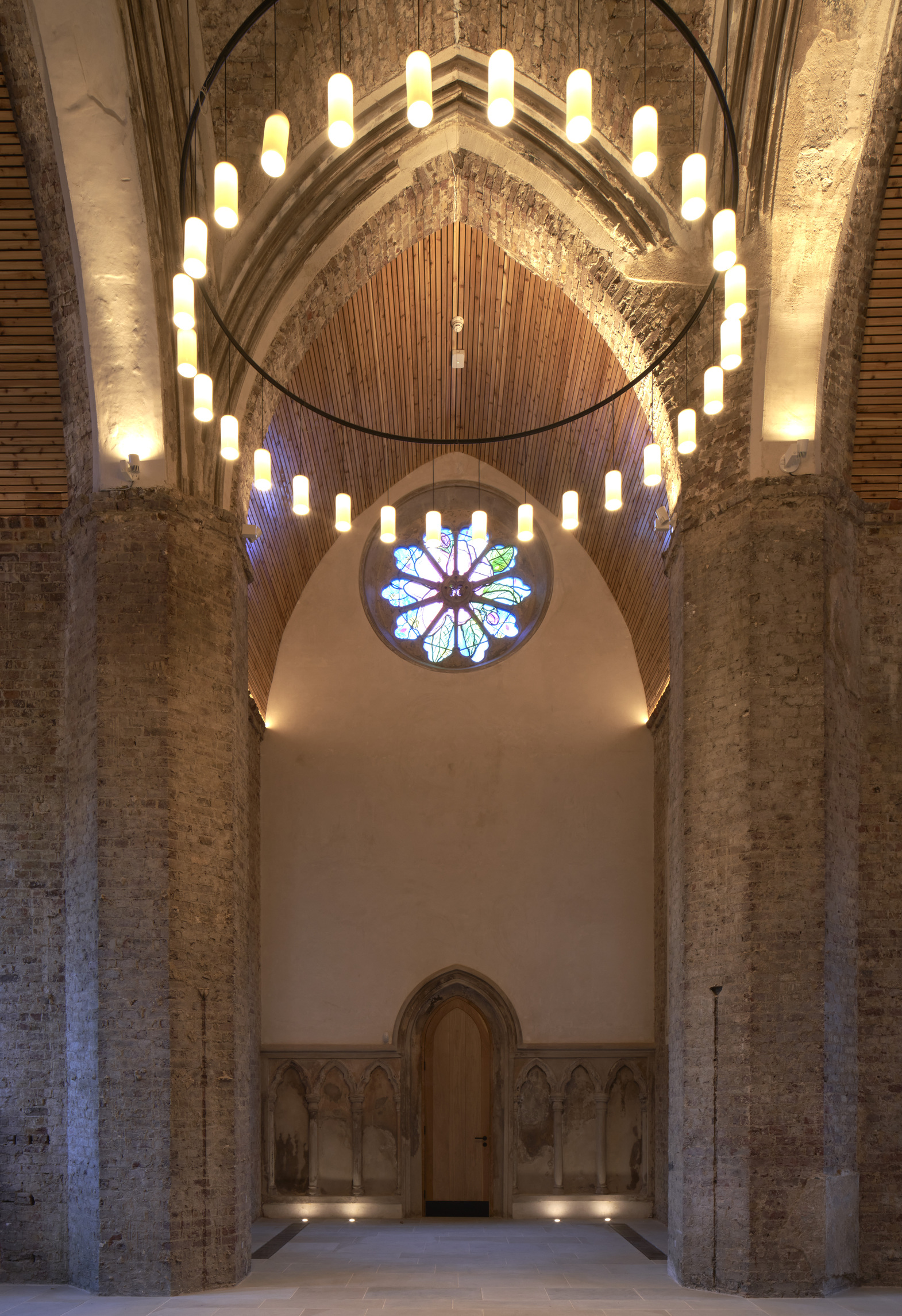Elegant Abney Park Chapel venue with vaulted ceilings and stained glass for events.