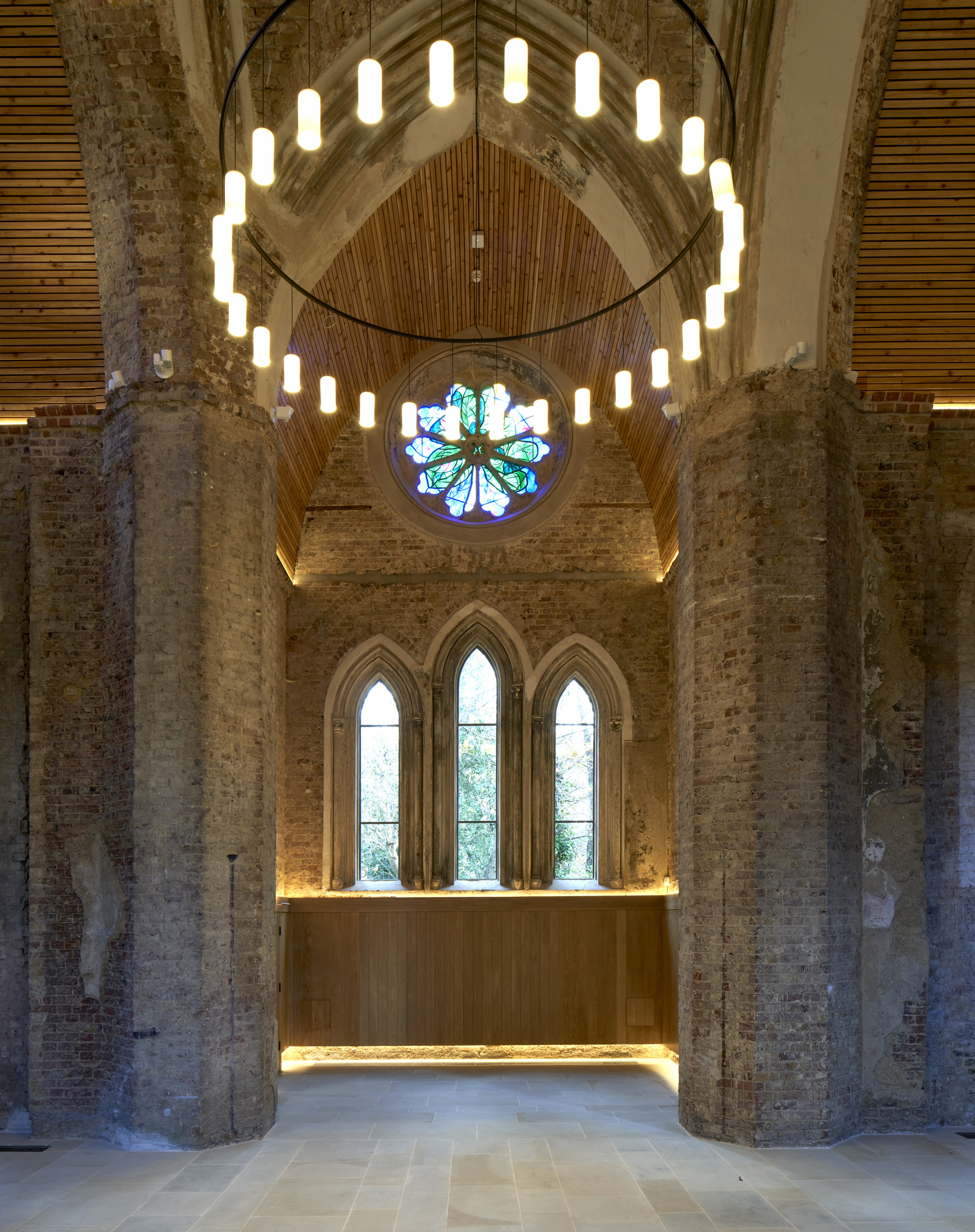 Whole Venue in Abney Park Chapel with arched windows, perfect for events and gatherings.