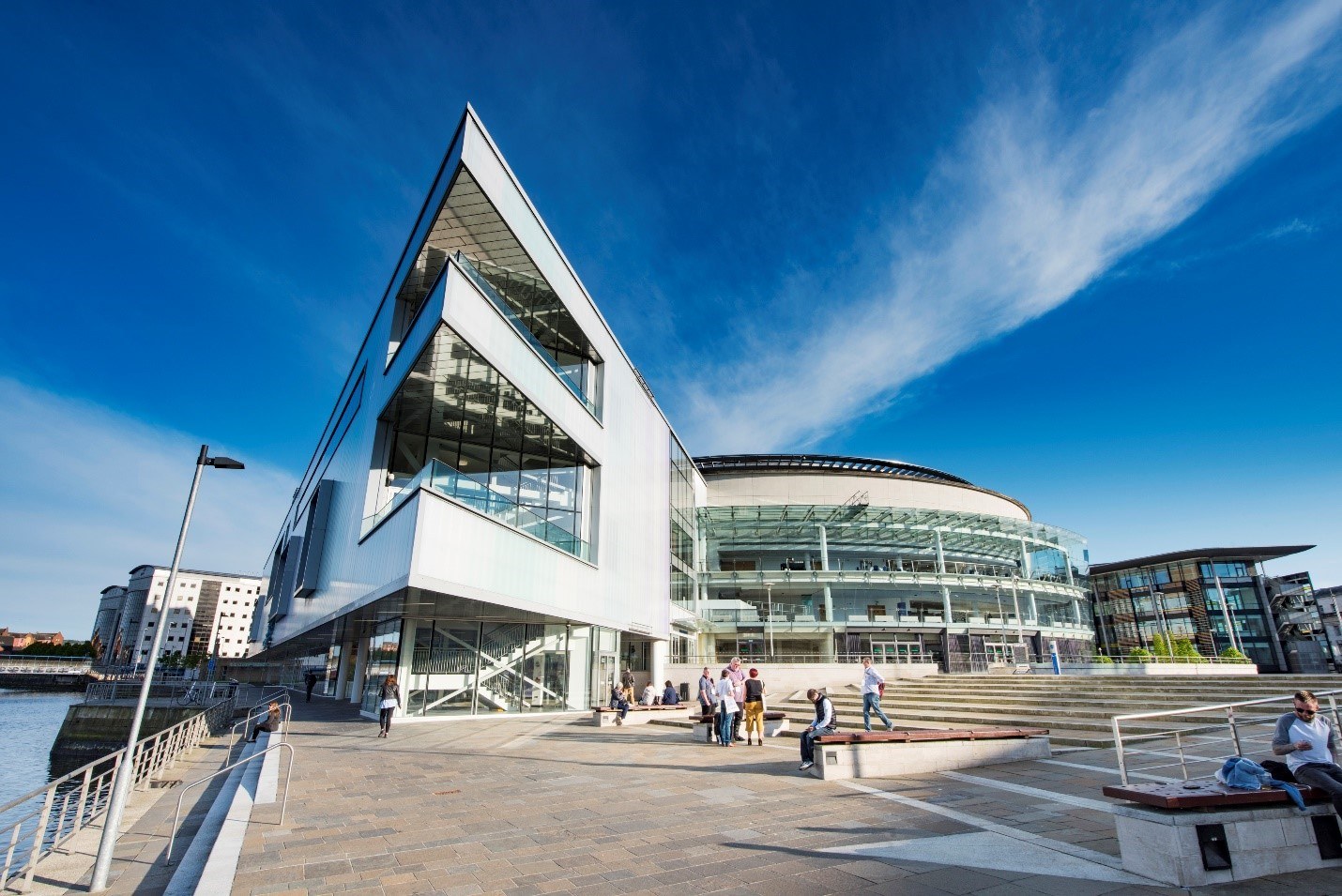 Modern ICC Belfast venue with large glass windows, ideal for conferences and gatherings.
