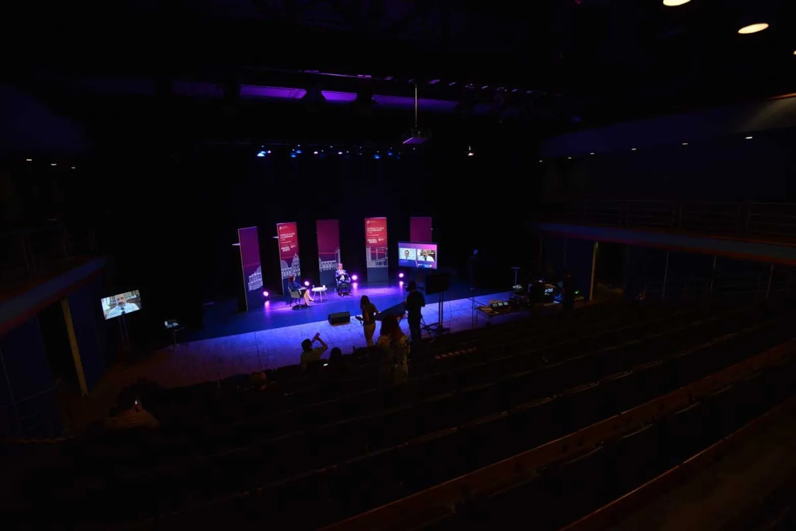 Spacious ICC Belfast studio with vibrant stage lighting for presentations and performances.