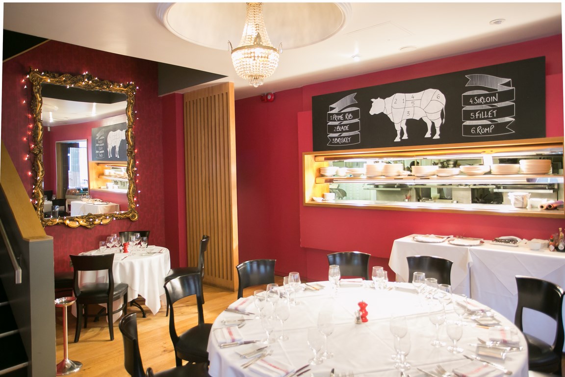 Deanes Meat Locker dining space with elegant tableware for corporate events and gatherings.