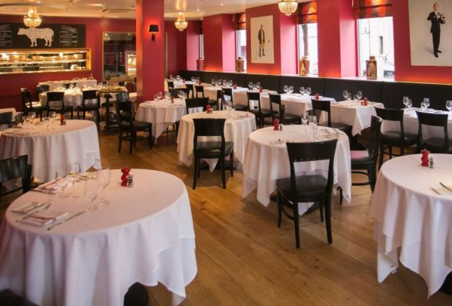 Flame Restaurant in ICC Belfast, elegant round tables for corporate events and gatherings.