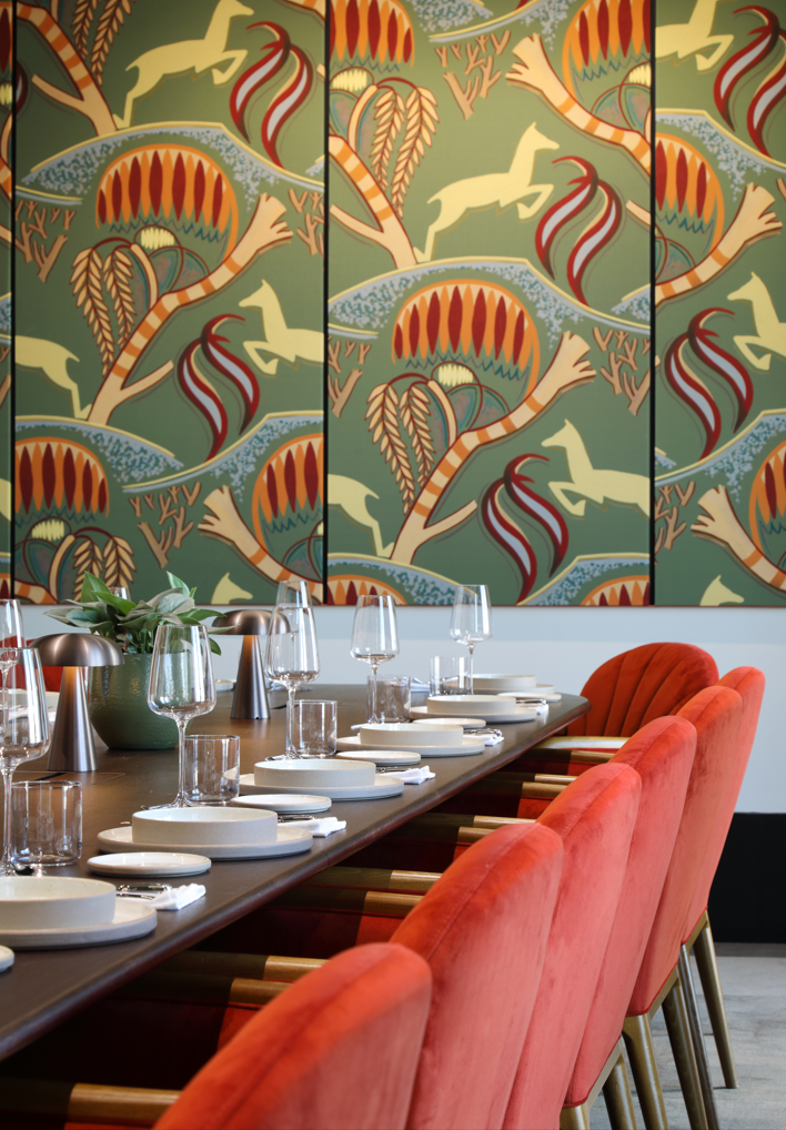 Stylish meeting space with elegant table settings for exclusive events and brainstorming.