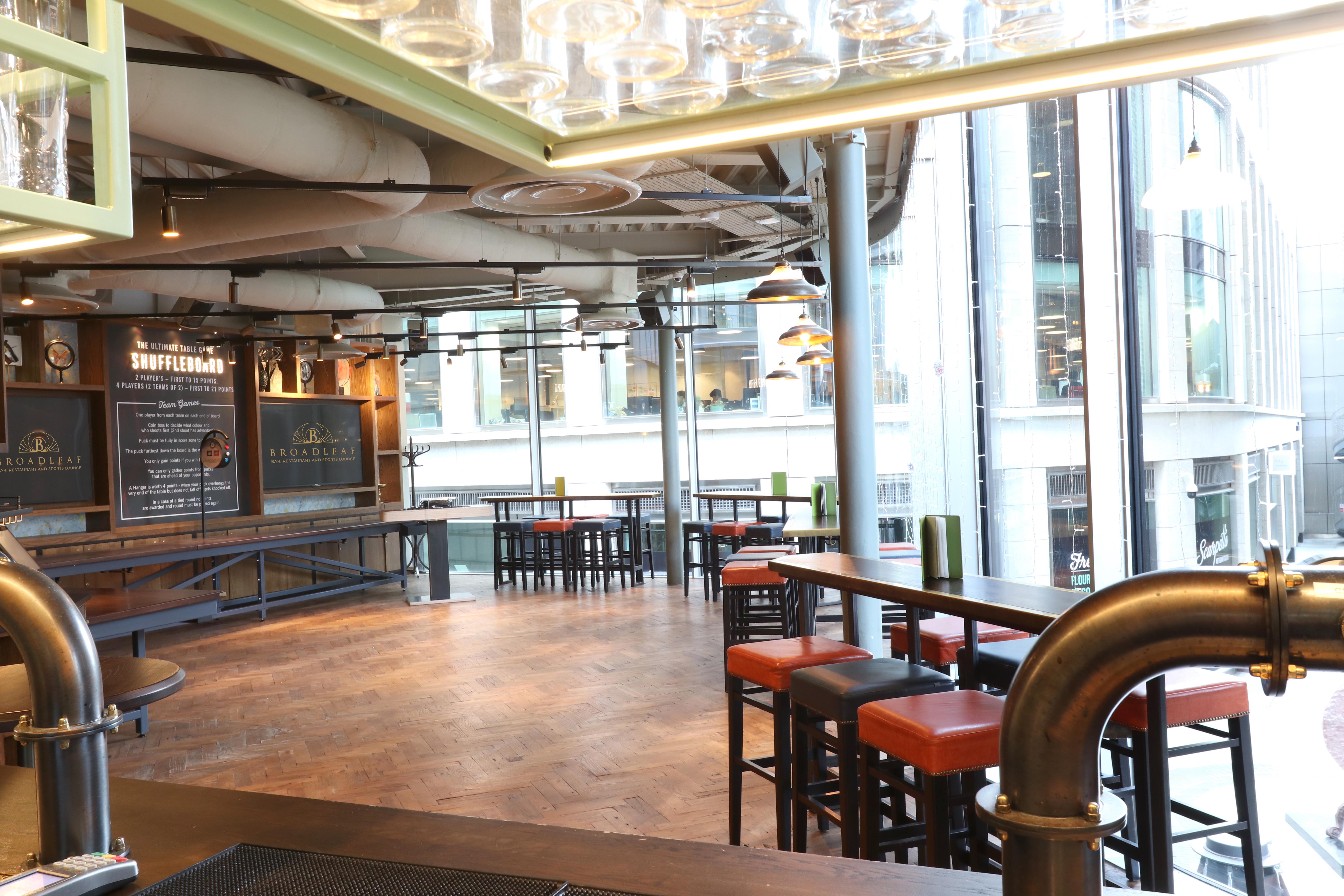 Modern event space with large windows, ideal for gatherings and meetings.