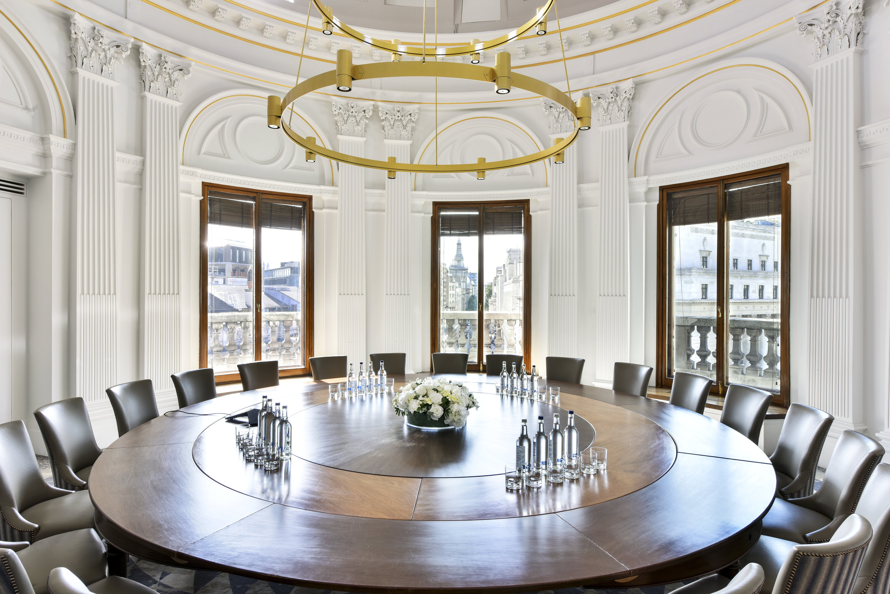 Rooftop bar meeting room with circular table and elegant decor for professional events