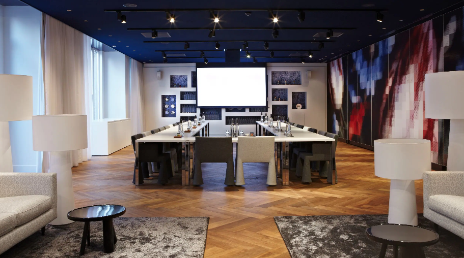 Modern meeting room in Andaz Amsterdam with sleek decor for professional events.