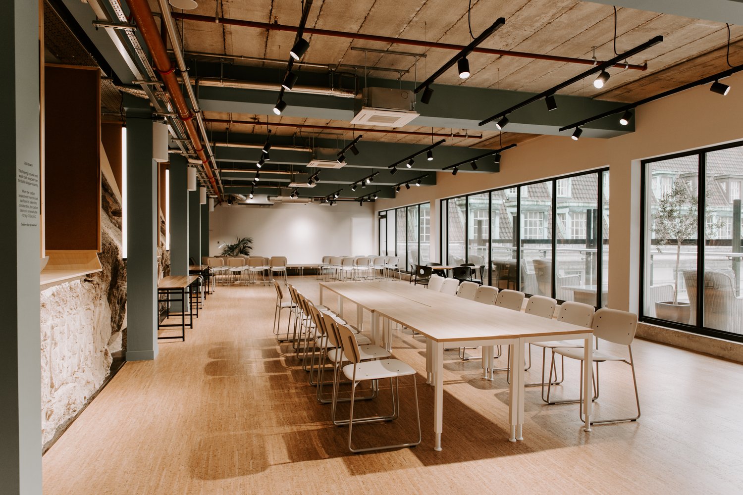 Versatile meeting space with natural light for workshops and team meetings at Event Hub.