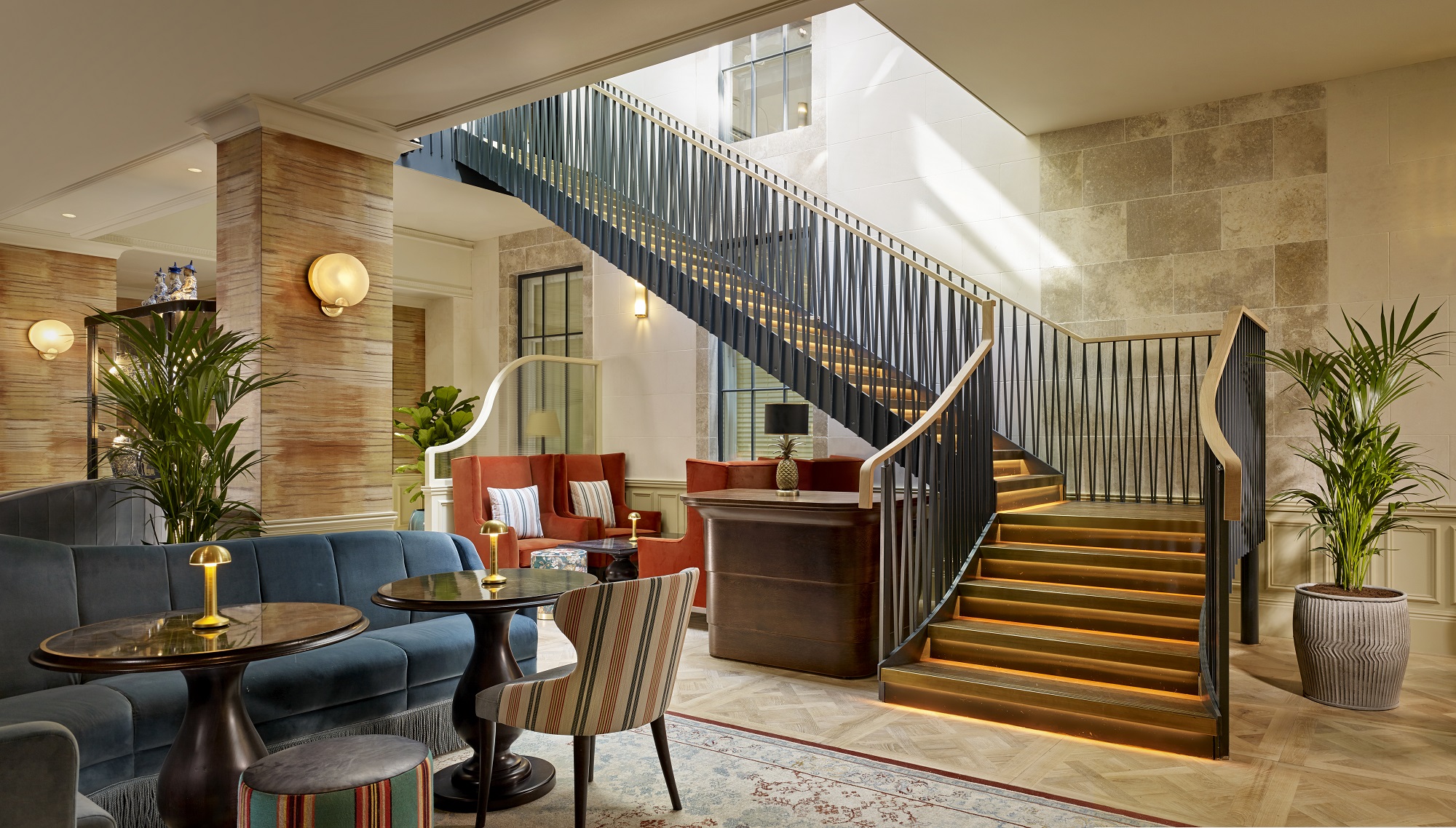 ESQ Bar lobby at 100 Queen's Gate Hotel, featuring elegant staircase for events and meetings.