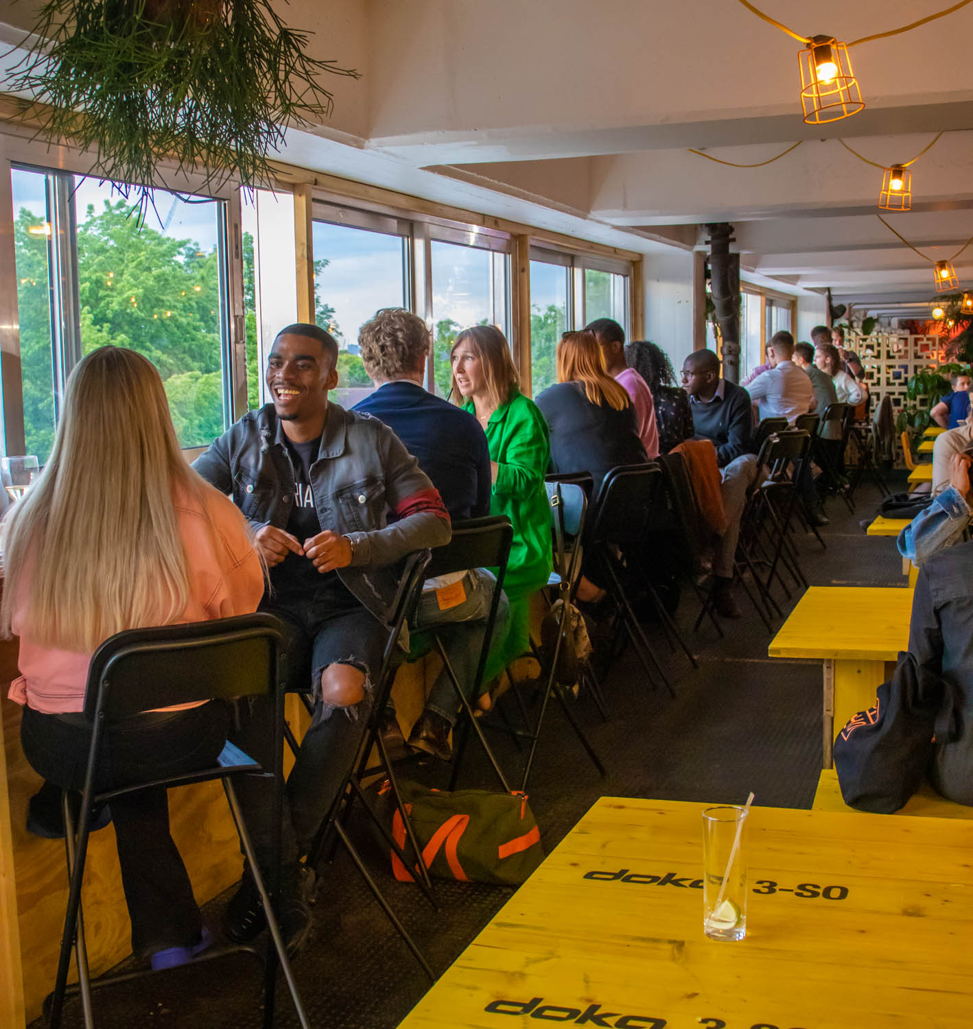 Vibrant networking event at The Bar and Food Hall, Peckham Levels, with modern decor.